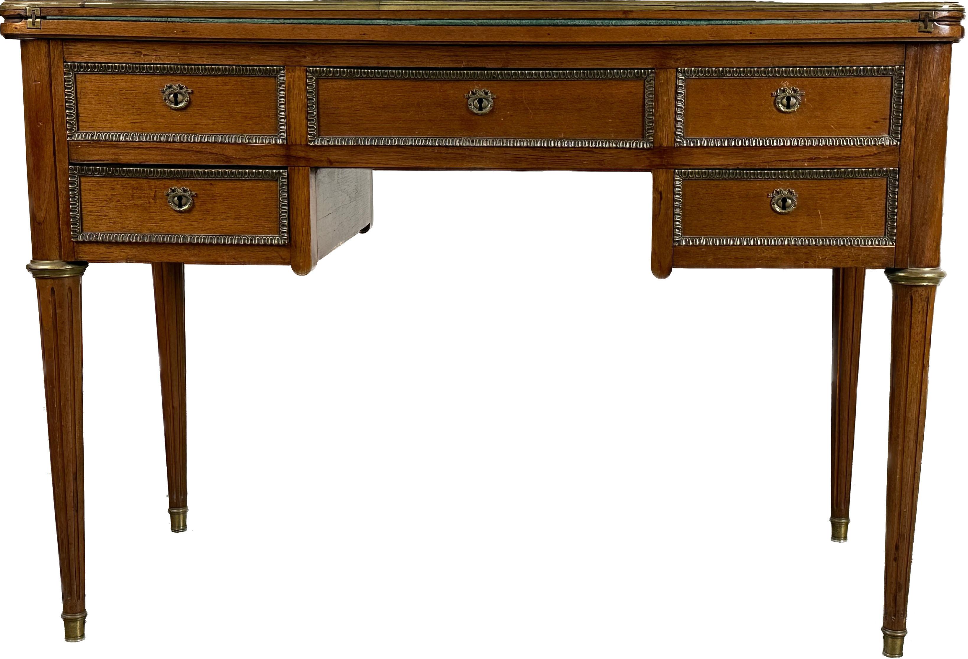 This folding game desk table replicates perfectly the Louis XVI-style elegance in both shape and quality. 
Boasting double-sided versatility, one face features four petite drawers next to a generously sized central compartment, while the back