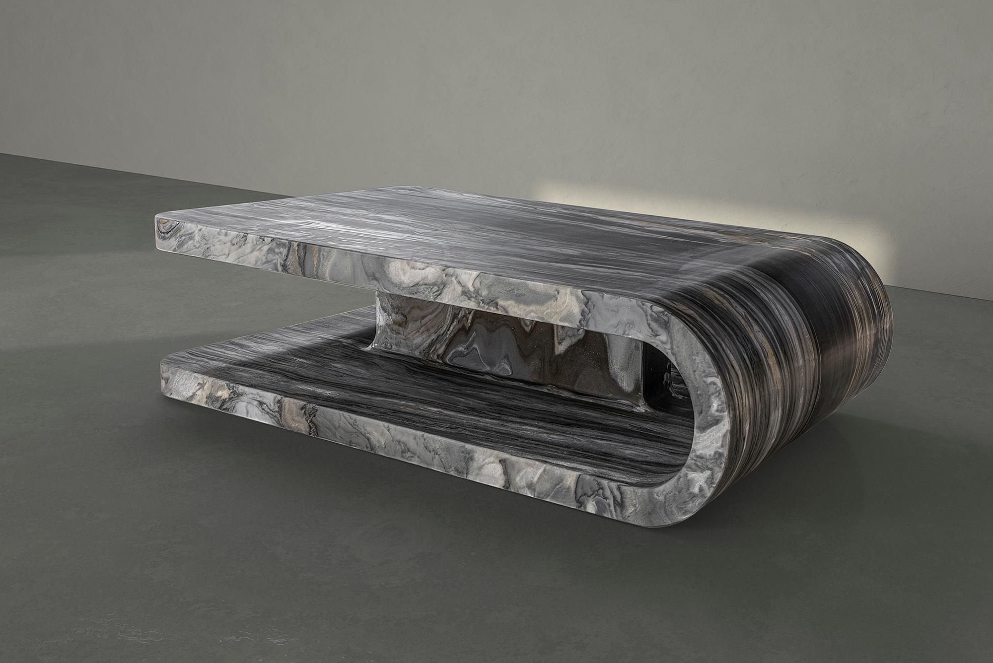 Carved from a single block of exclusive Calacatta Midnight marble, Fold blends sculptural aesthetic with minimalism design. The table’s curved silhouette challenges the nature of the material while the extraordinary rich pattern of the marble