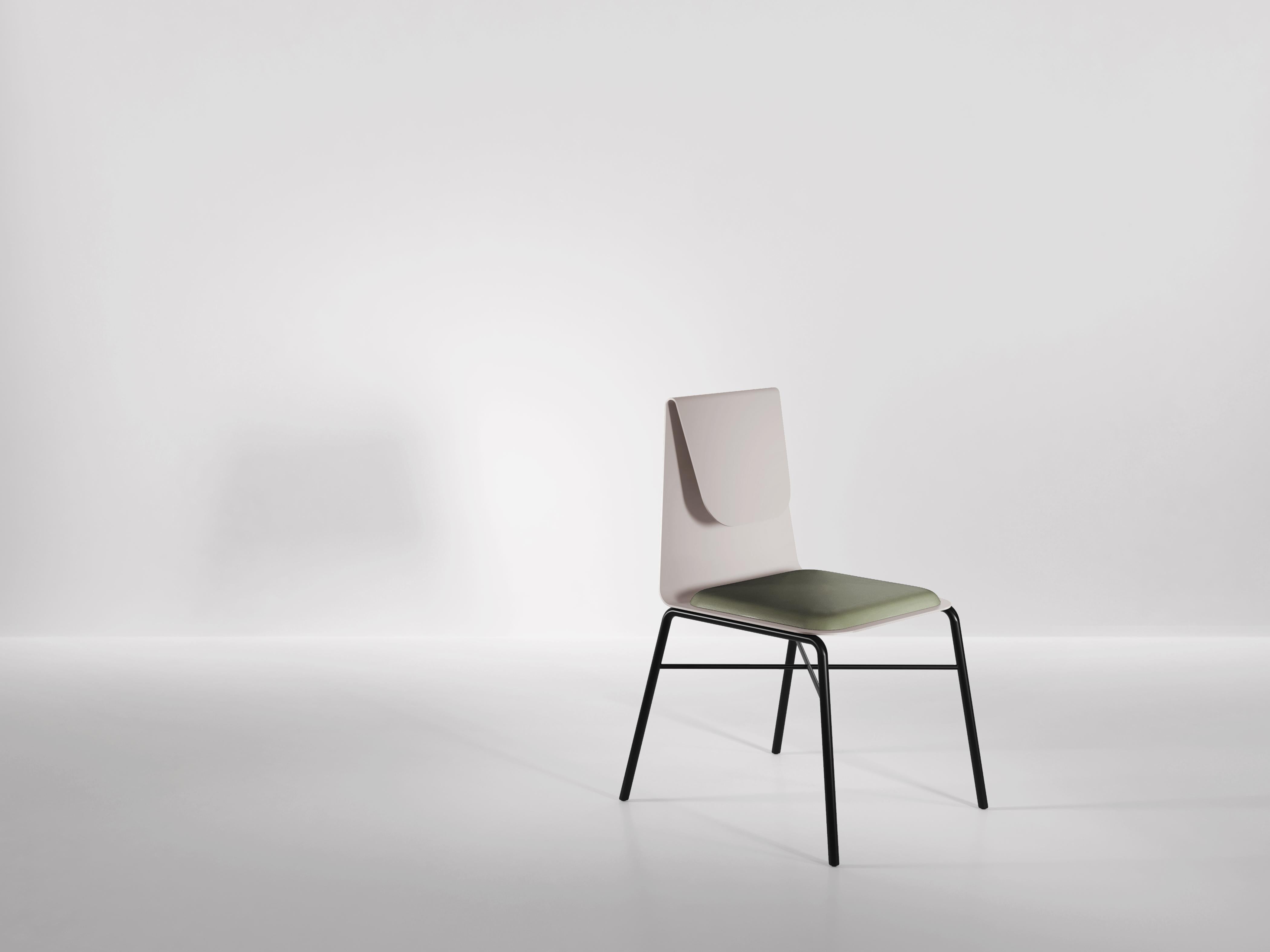 The Fold dining chair is constructed from one piece of metal - bent in two places to offer both support and flexibility when leaned upon. A fully customisable, upholstered cushion sits on top of the metal for added comfort. The seat is supported by