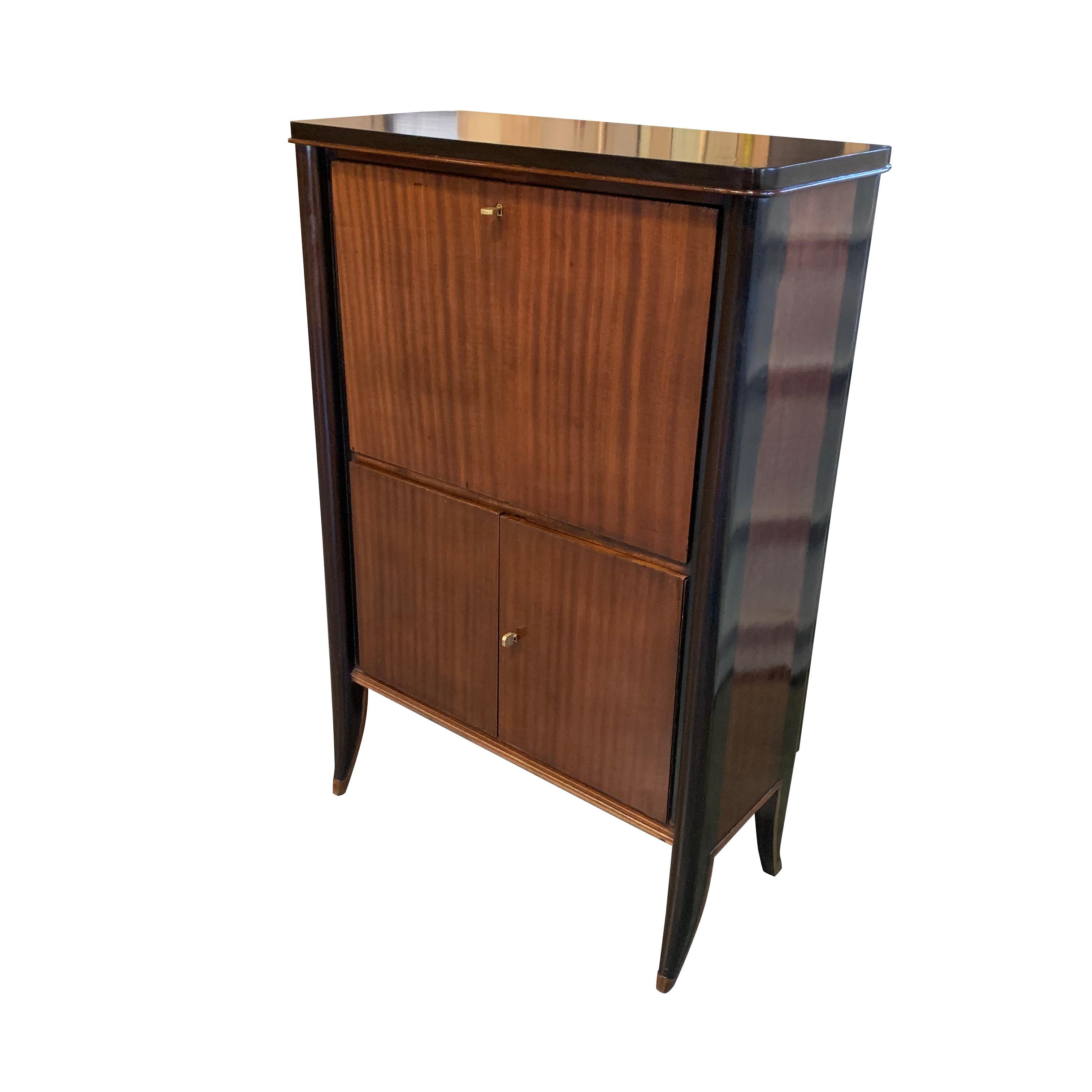 1940s French high polished palisander exterior with ebonized trim fold down desk
Upper cabinet interior with shelves and small door with interior compartment
Bottom two doors with interior shelves.
          