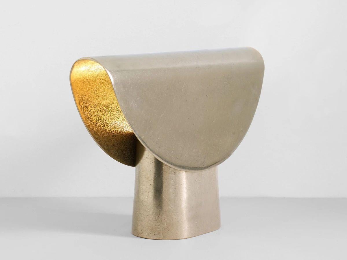 Brass Fold Light by Henry Wilson
Dimensions: W 35 x D 9 x H 23 cm
Materials: Brass

A cast light which appears to have been draped over it's base. A light fitting is captured inside and glows outward.

Each casting is manufactured in small batches
