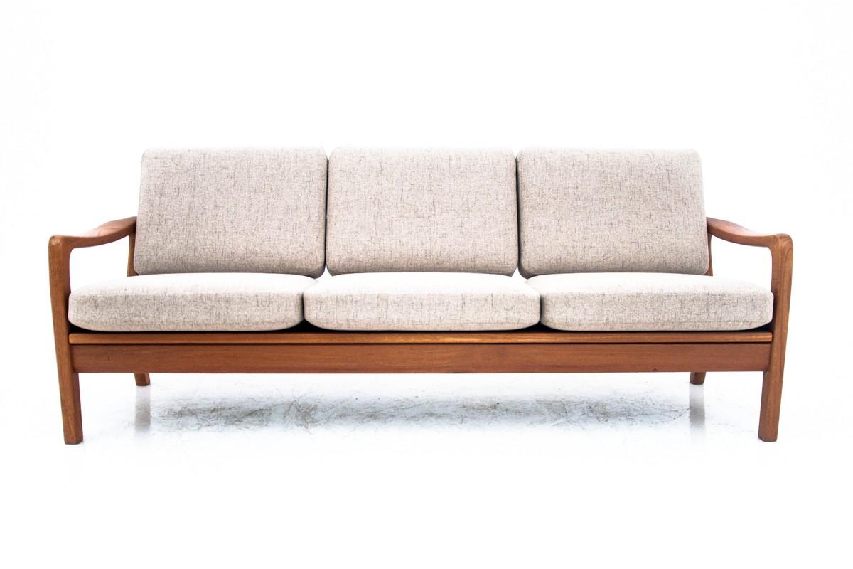 A sofa bed made of teak wood, designed by Juul Kristensen, produced by JK Denmark.

The furniture is in very good condition, after renovation, the cushions have been covered with a new neutral beige fabric

Dimensions: height 82 cm / height of