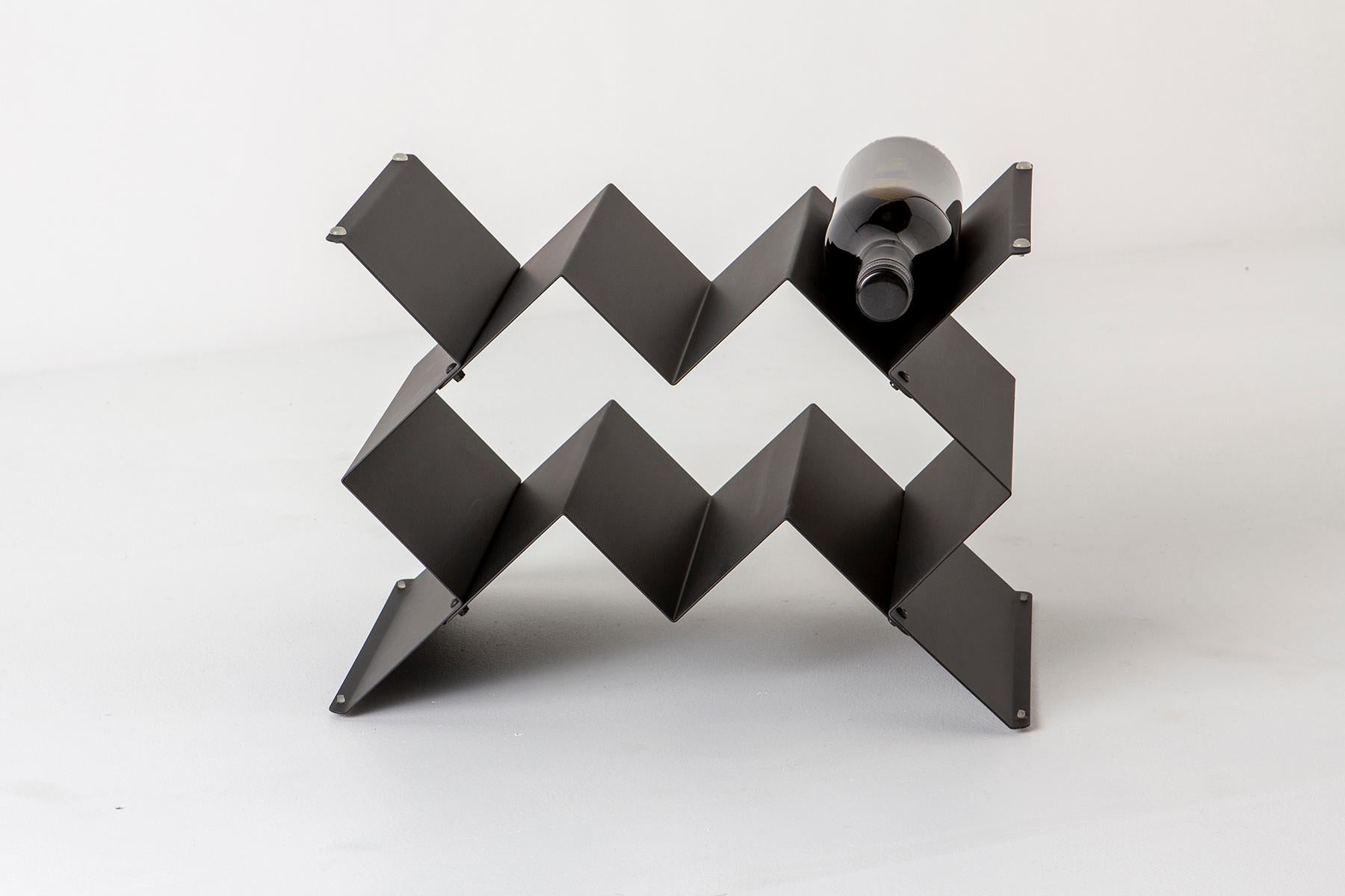 Fold wine rack is a Brutalist inspired modular design that can be stacked in a variety of sizes and configurations. Made from folded sheet metal with a powder-coated finish. The intention of the Fold collection is to express the purity of