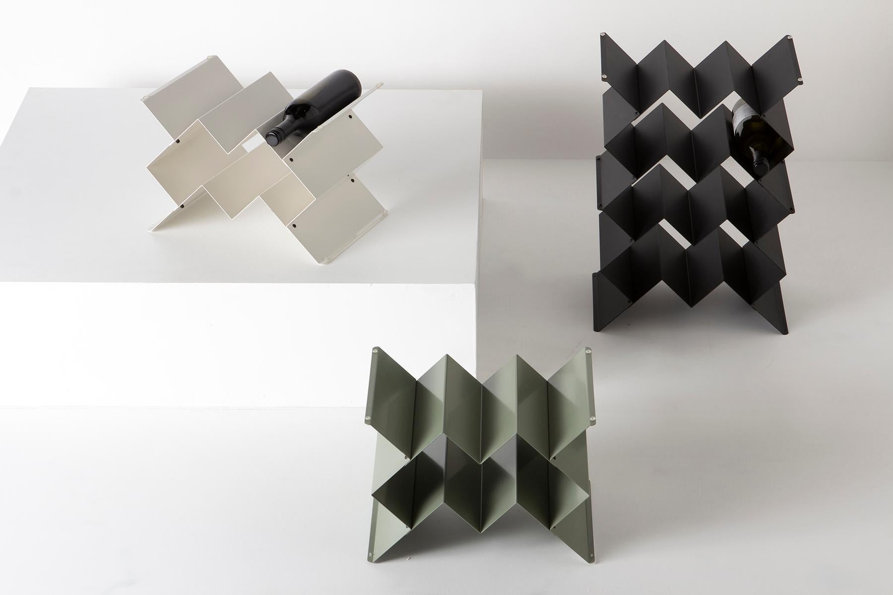 Fold wine rack is a Brutalist inspired modular design that can be stacked in a variety of sizes and configurations. Made from folded sheet metal with a powder-coated finish. The intention of the Fold collection is to express the purity of
