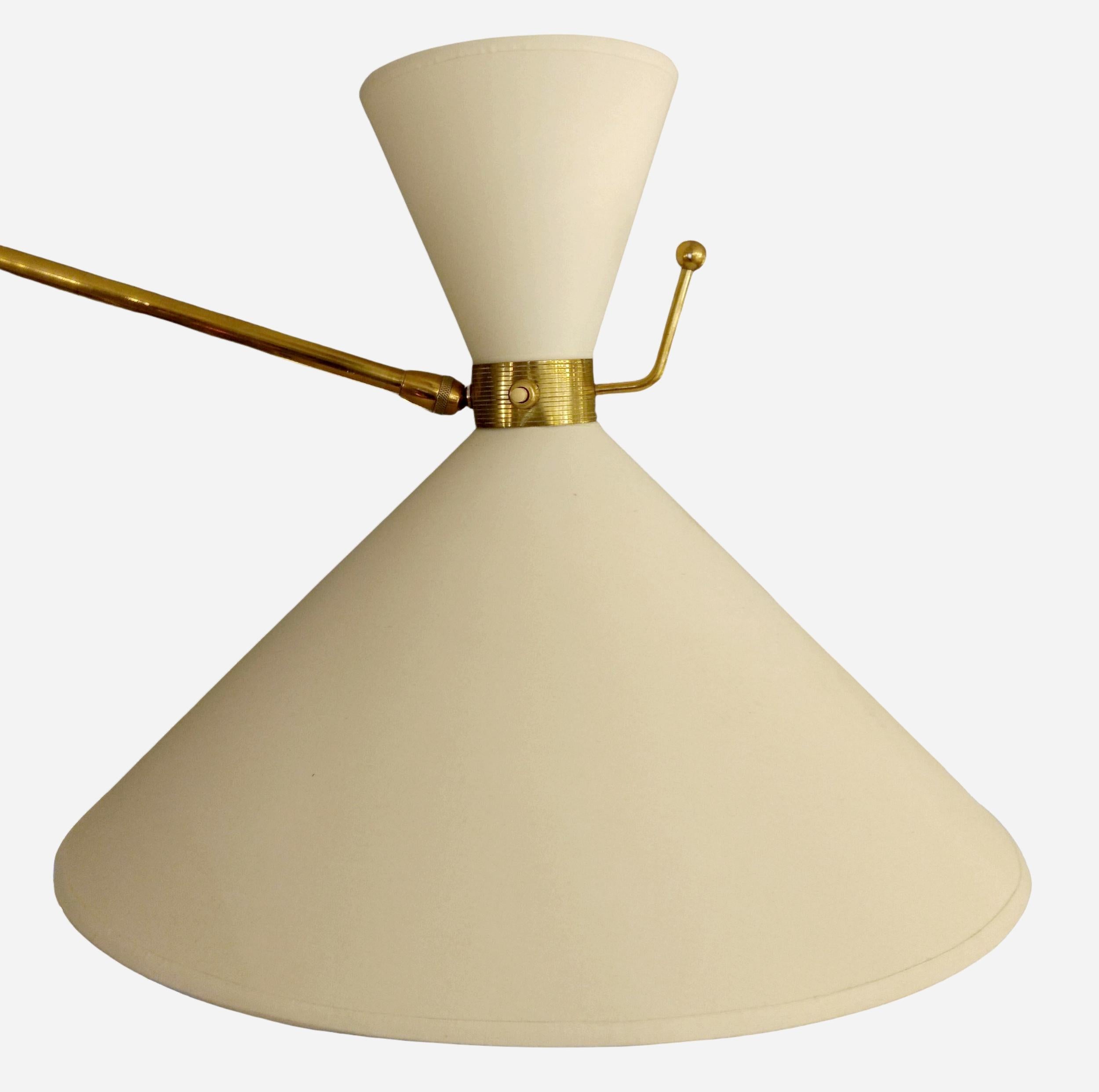 Large wall light, extendable and 180° rotatable, in black lacquered metal and polished brass.
The light arm rotates in the wall-mounted hook and can be extended. The lampshade is mounted on a ball-and-socket joint.
New lampshade and bulb cover,