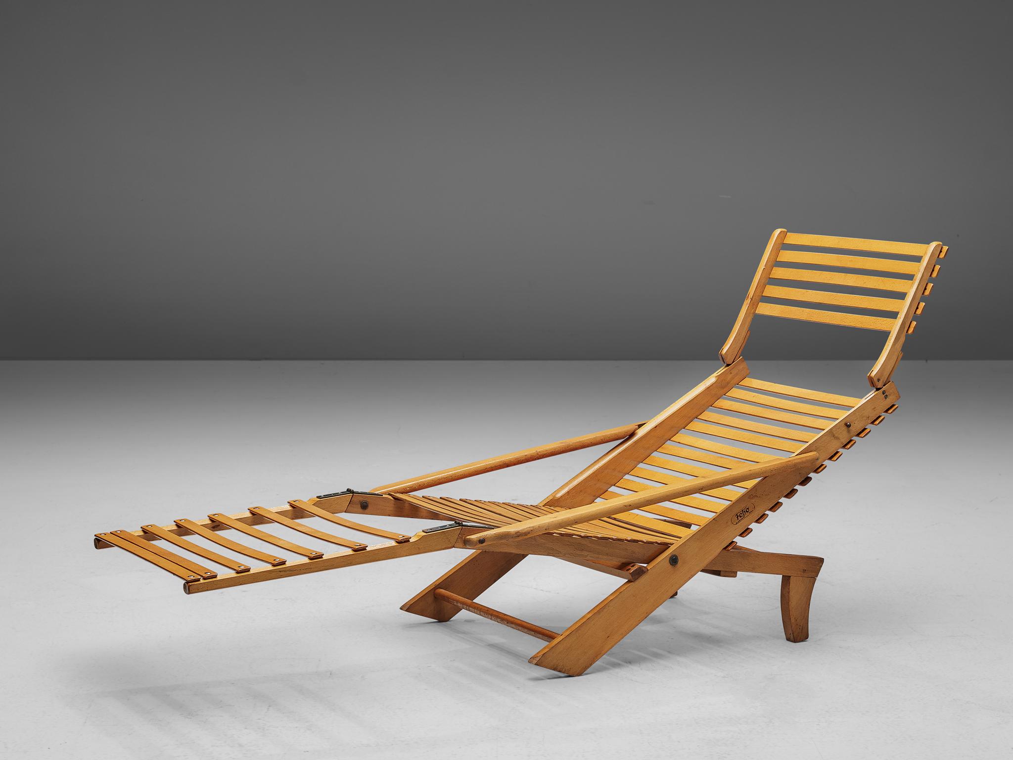 Feho Germany, foldable chaise lounge, stained solid beech, metal, Germany, 1930s

A rare-to-find foldable chaise lounge from the 1930s. Adjustable in different angles the chair provides great comfort and practical usage. The horizontally placed