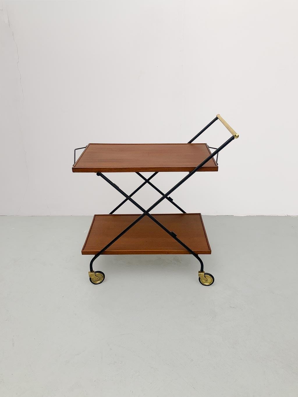 1960s Italian food bar cart. Black iron frame, walnut shelves and brass details. High shelf that can be used as a tray. Foldable. Natural signs of aging due to use. Condition good.