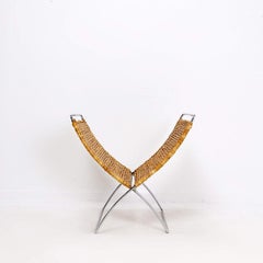 Foldable magazine rack in chrome and banana leaves