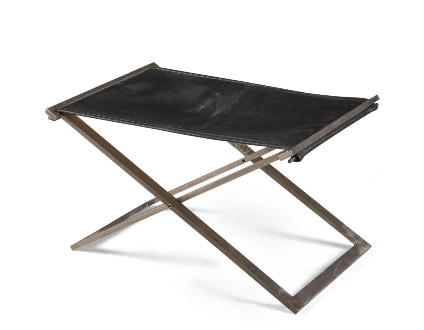 Michael Christensen foldable stool, model Rough # 1 with 10 mm hand-painted flat steel frame, stretched seat with black semianiline leather with light canvas backing. Measures: H. 36. L. 60. B. 40 cm. Wear marks on the underside of the leather, and