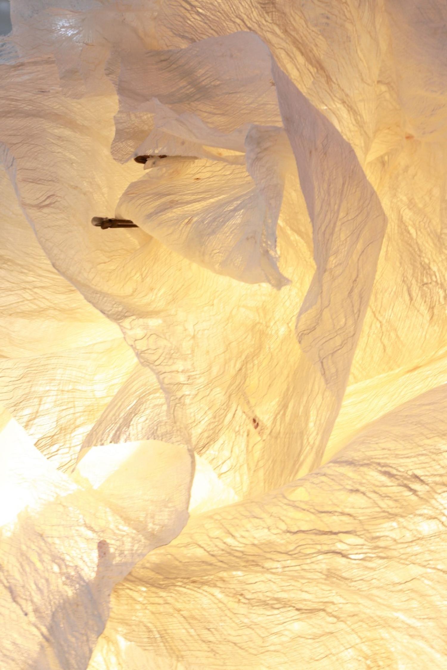 Folded by Ango is a sculptural wall light that combines contemporary design with handcrafted artistry. Made from natural mulberry tree bark fibre, each piece is delicately hand-formed into a flowing, organic shape that functions as both a