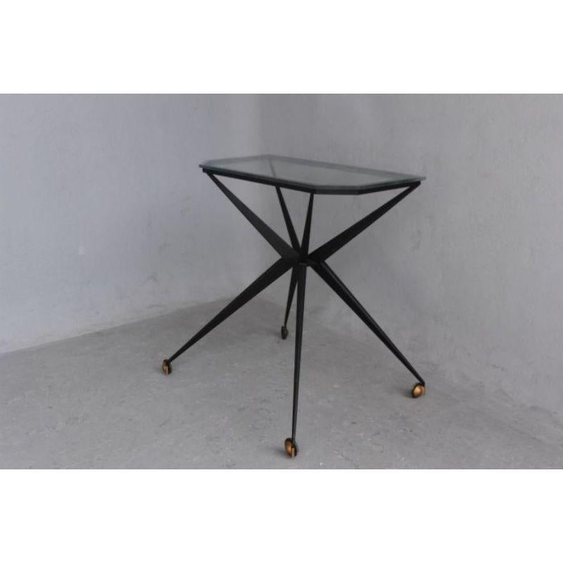 1950 folded metal and glass table, height 76 cm, length 75 cm and depth 36 cm. Work in the spirit of Jean Prouvé brass casters

Additional information
Style: 40s 60s
Material: Metal & Wrought iron, glass & crystal.