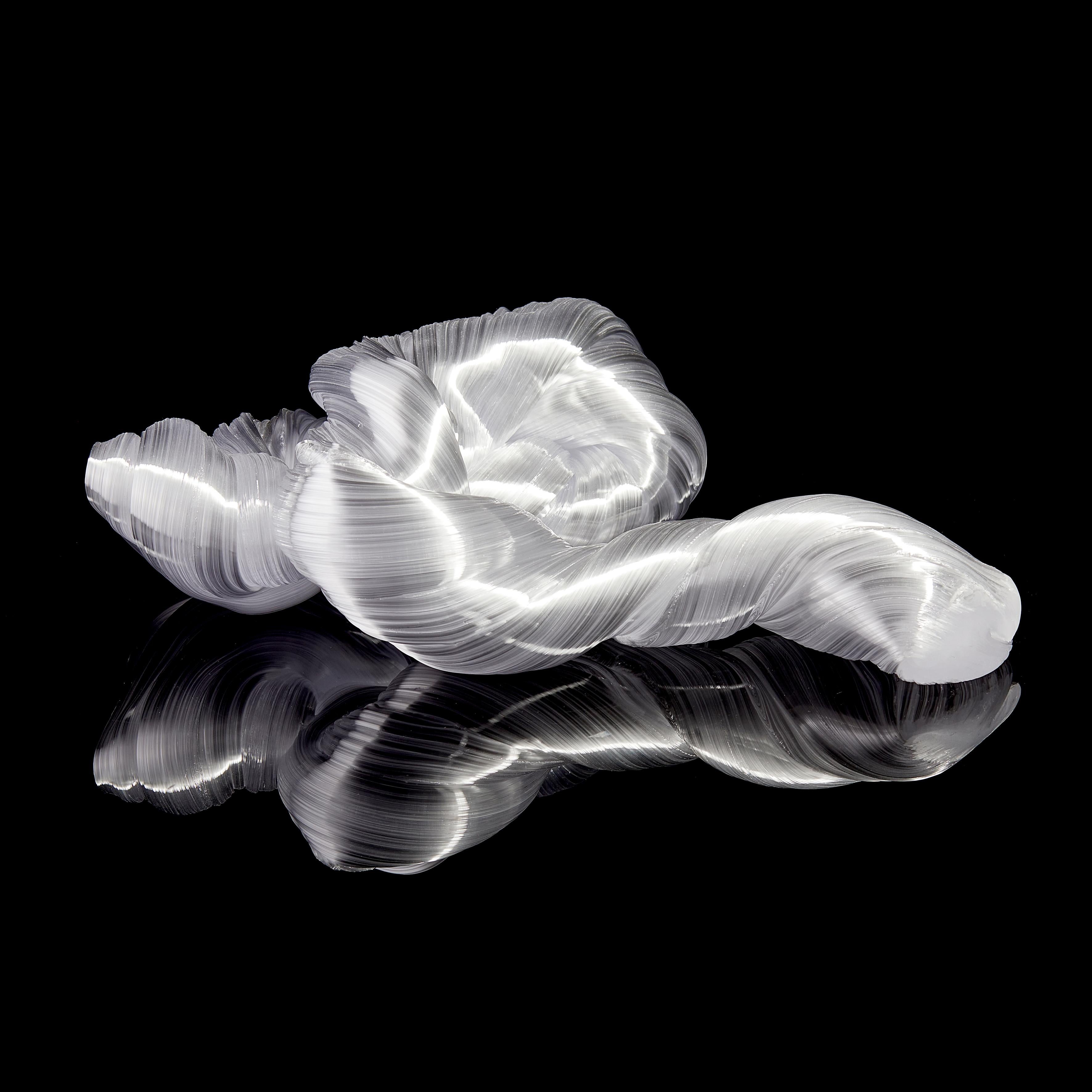 Folded Rock in white is a unique bronze glass sculpture by the Danish artist Maria Bang Espersen. With fluid lines and movement, this sculptural artwork is dramatic, elegant yet inspires the inner child with memories of candy canes and sugary