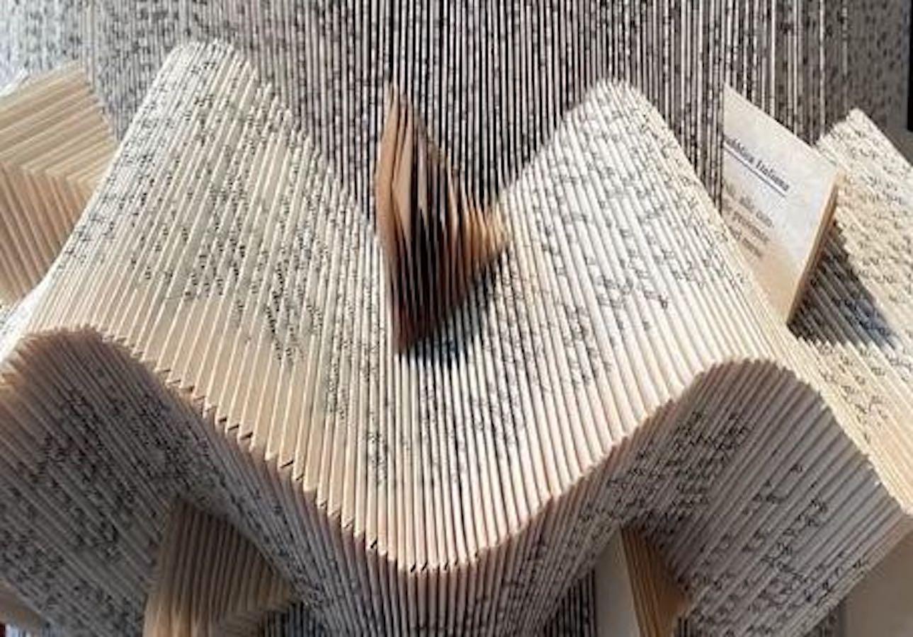 Contemporary Italian hand folded book mounted on burled wood. 
Creates decorative and unusual wall sculpture.
Each book is hand folded creating four different styles.
   
   
   
