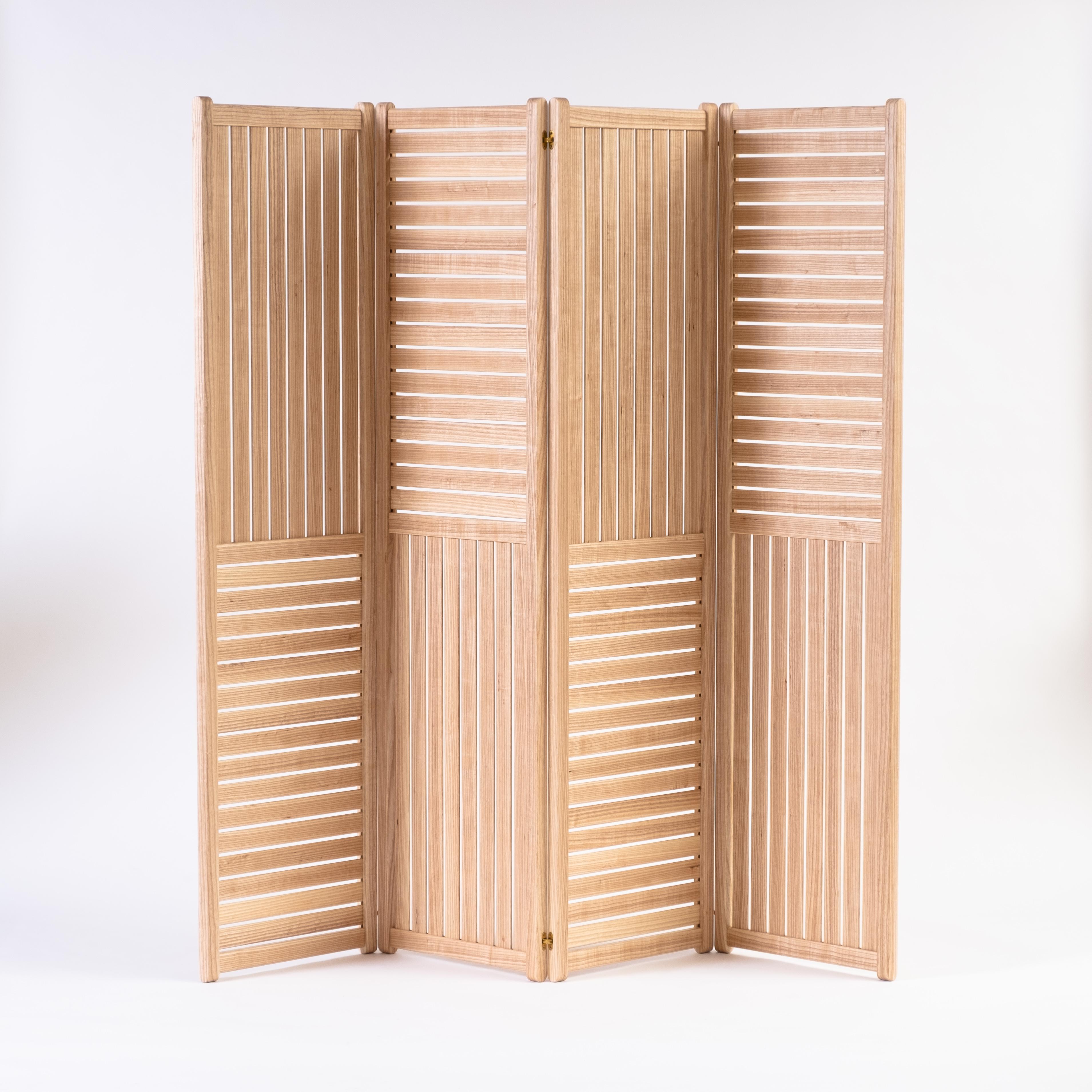 This folding screen / room divider uses repeating patterns of horizontal and vertical slats to create an object that is both functional and visually interesting.

The screen can be used as a purely decorative object, adding texture and movement to