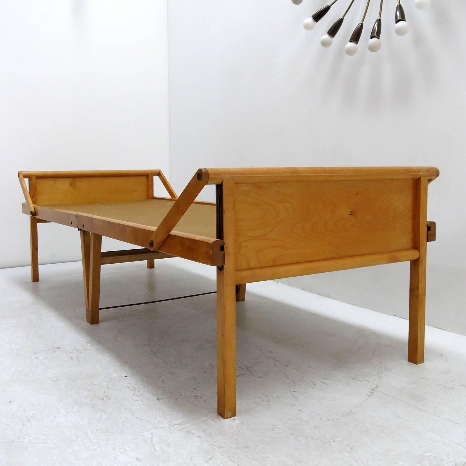 wonderful folding bed by Brdr. Johansson Sweden, in solid birch with canvas, marked Brdr. Johansson & Co., Turistsängen 'Tor', Smålandsstenar, Patent 36528,.