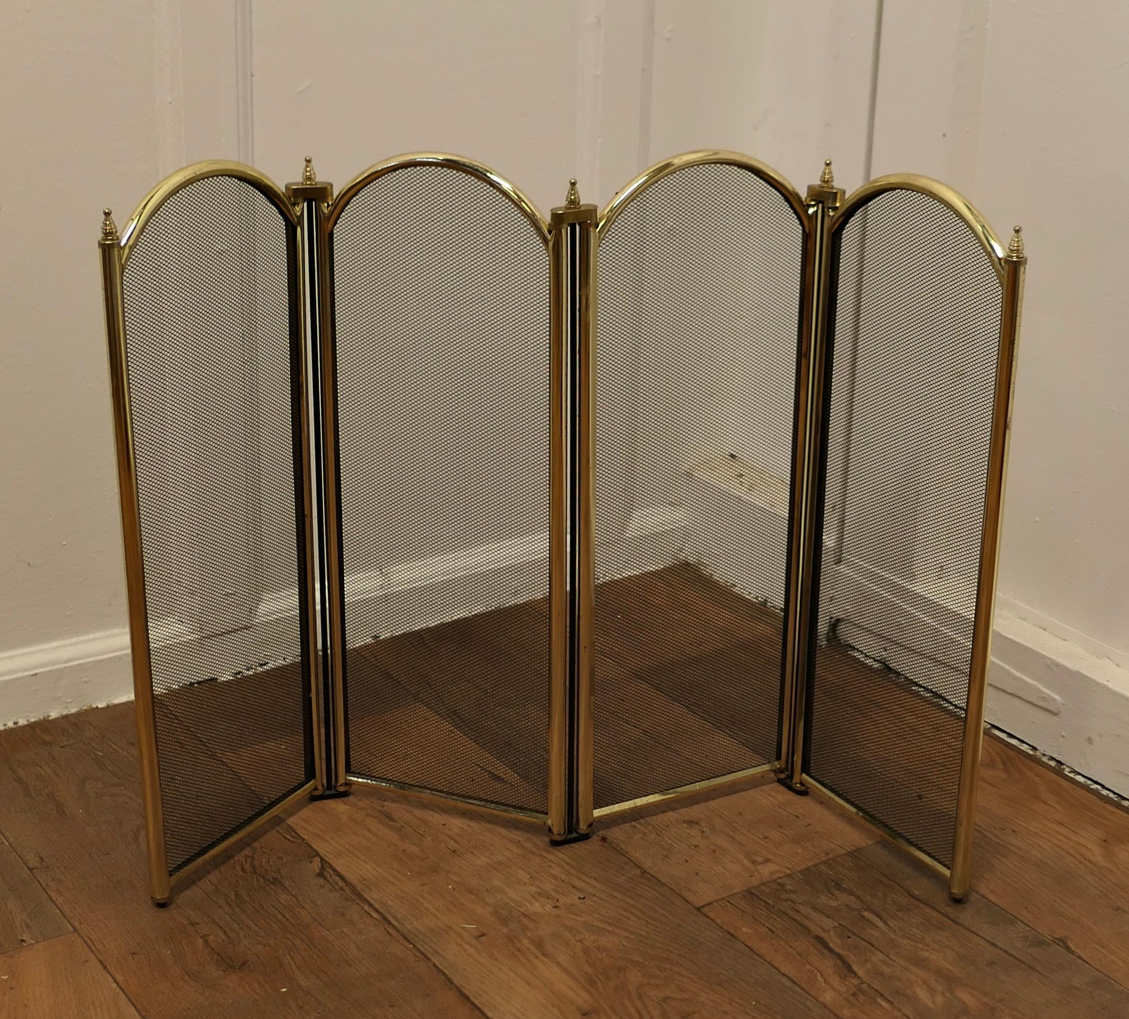  Folding Brass and Iron Fire Guard for Inglenook Fireplace

This very useful spark guard has a 4 fold brass frame and a fine black mesh infill decorated with brass finials along the top 
When opened out the screen can be shaped to enclose your fire,