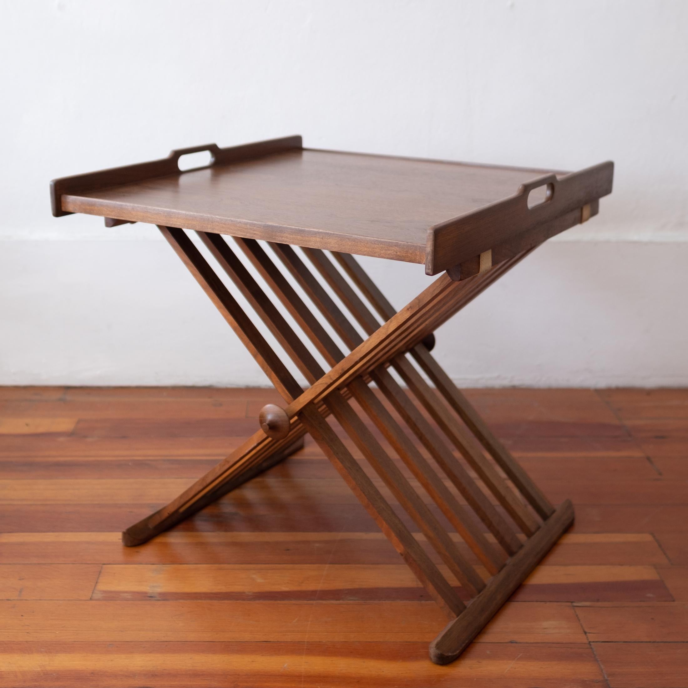 Folding Campaign tray table by Kipp Stewart and Stewart McDougall. Beautiful walnut grain. Labeled on the tray bottom.