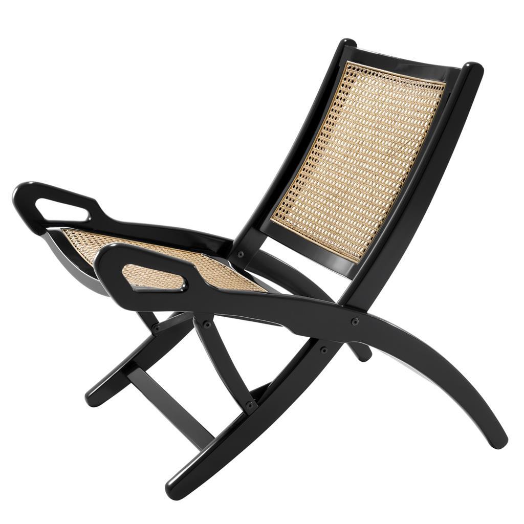 Folding cane rattan and blackened mahogany folding lounge chair, modern revival of a colonial lounge design.