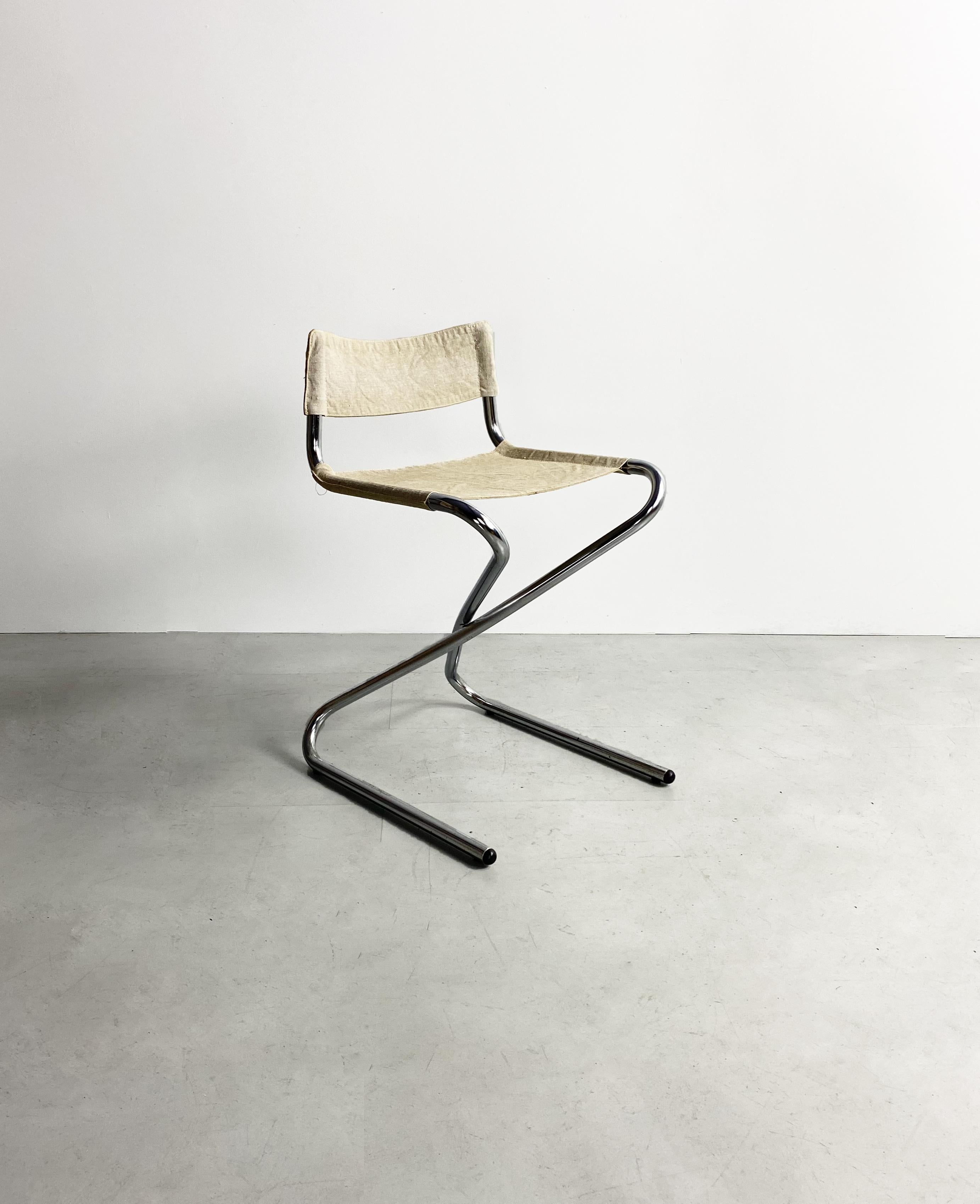 Early model Z-chair designed by Danish designer Erik Magnussen. This item was produced in 1960s for Torben Orskov. This model was never really in production. Chromed bent tubular frame, folding chair with off white canvas upholstery. Originally