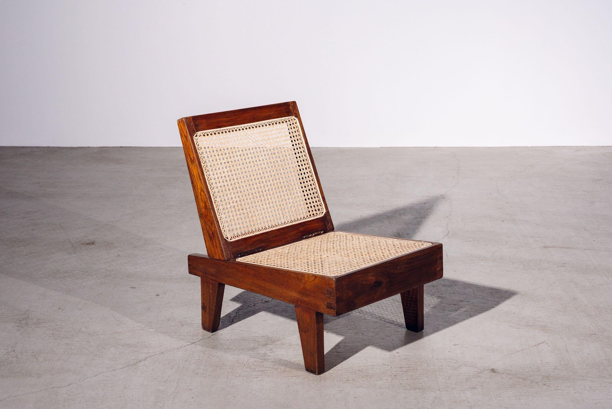 An authentic mid-century piece from Pierre Jeanneret’s legendary Chandigarh commission. Teak frame with hand-woven bamboo-rattan seat & back.

Letter : CHD.ADMN. (Chandigarh Administration)