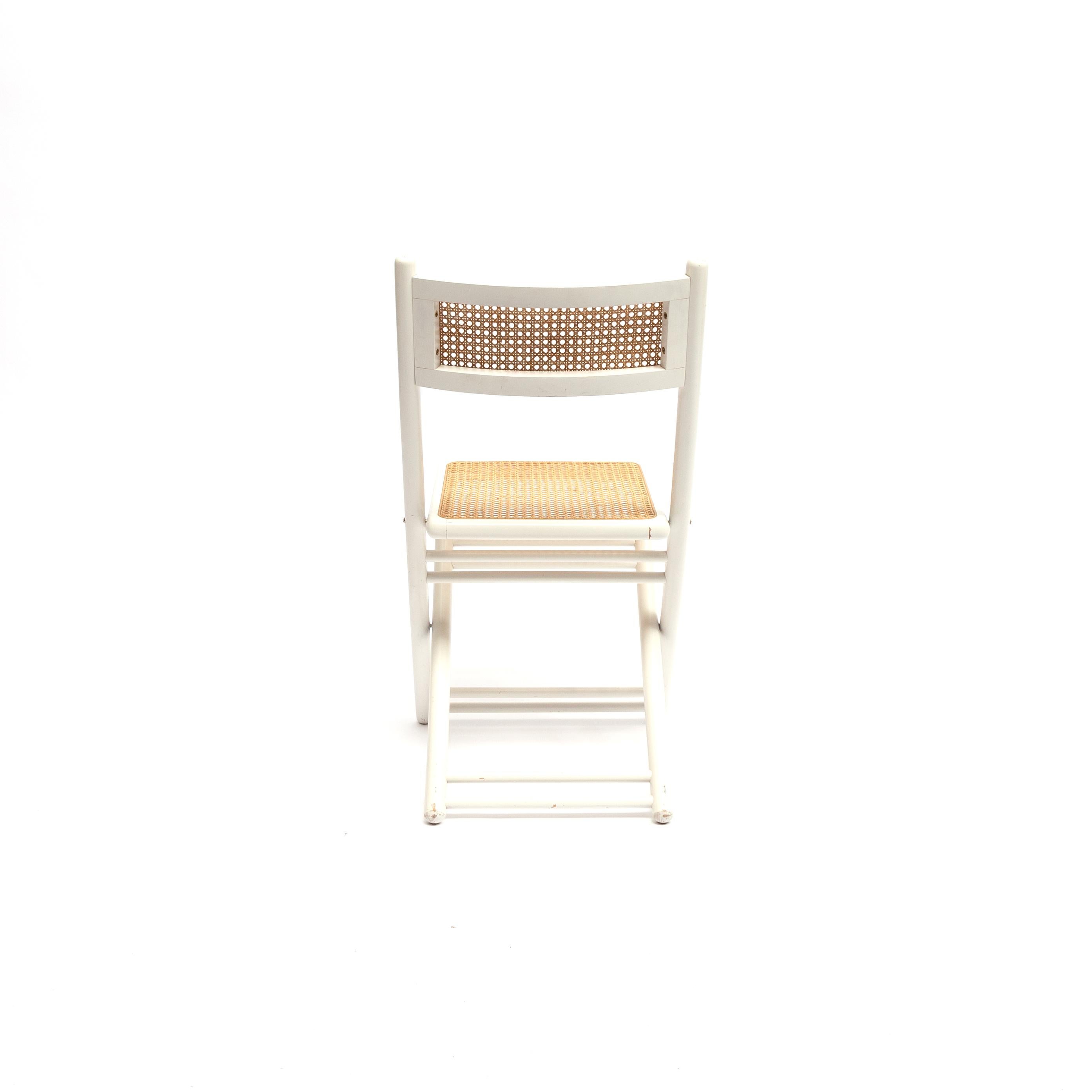Original folding chair in white lacquered wood with webbing seat and backrest, in the typical Thonet style, circa 1960s-1970s. Original and ready to use condition.
 