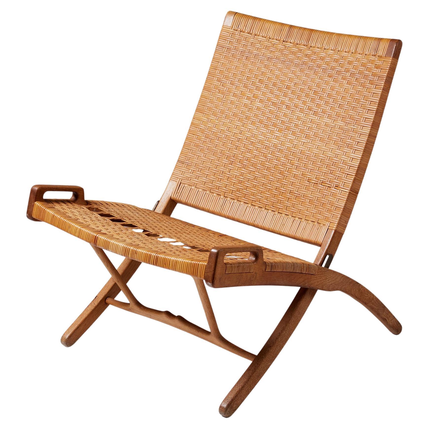 Folding chair model JH 512 designed by Hans J. Wegner for Johannes Hansen, 1949 For Sale