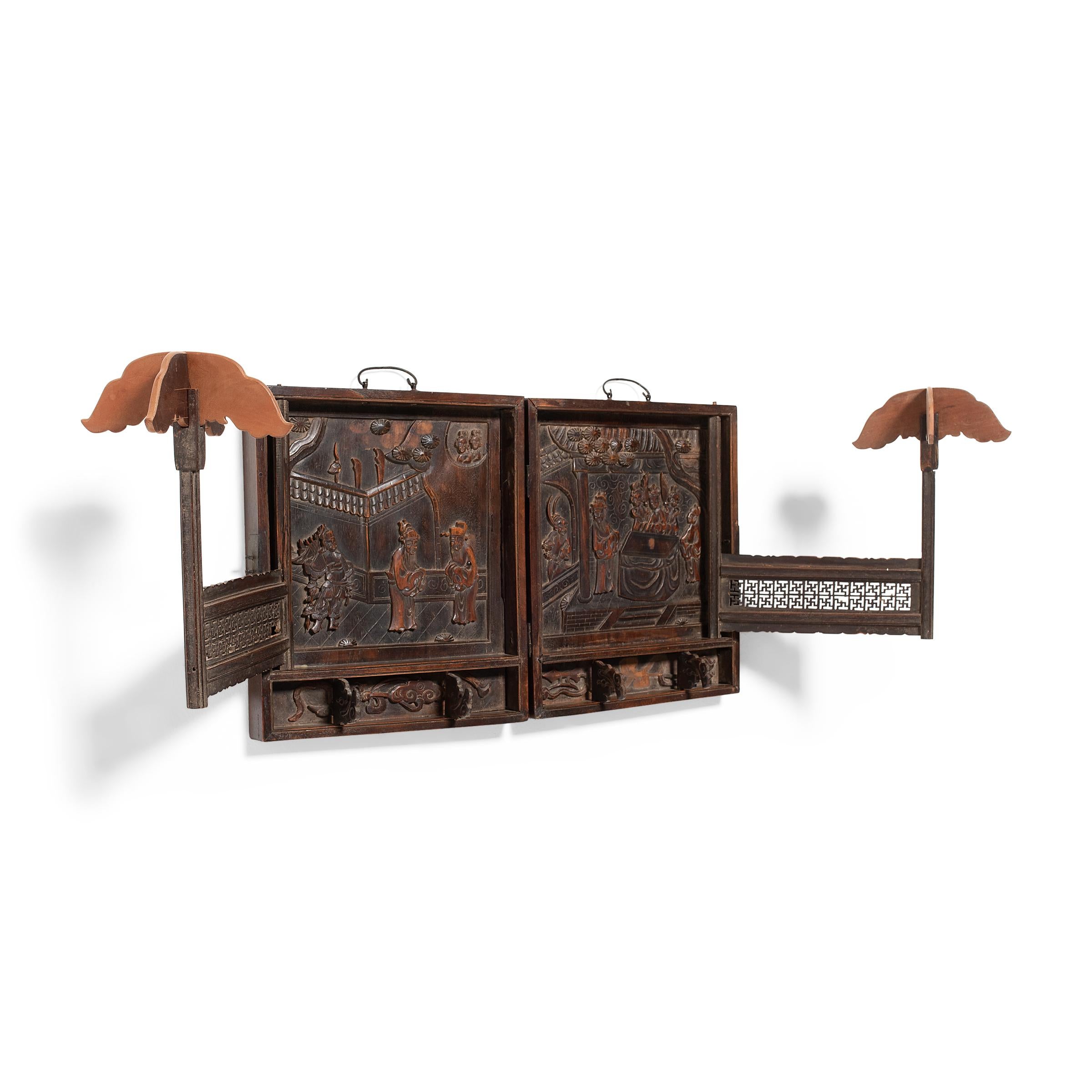This folding hat rack displays the opulence of court fashion, where rank and status was expressed through fashion and its accouterments. During the Qing dynasty, wearing a hat was customary for any respectable man. When not in use, their hats were