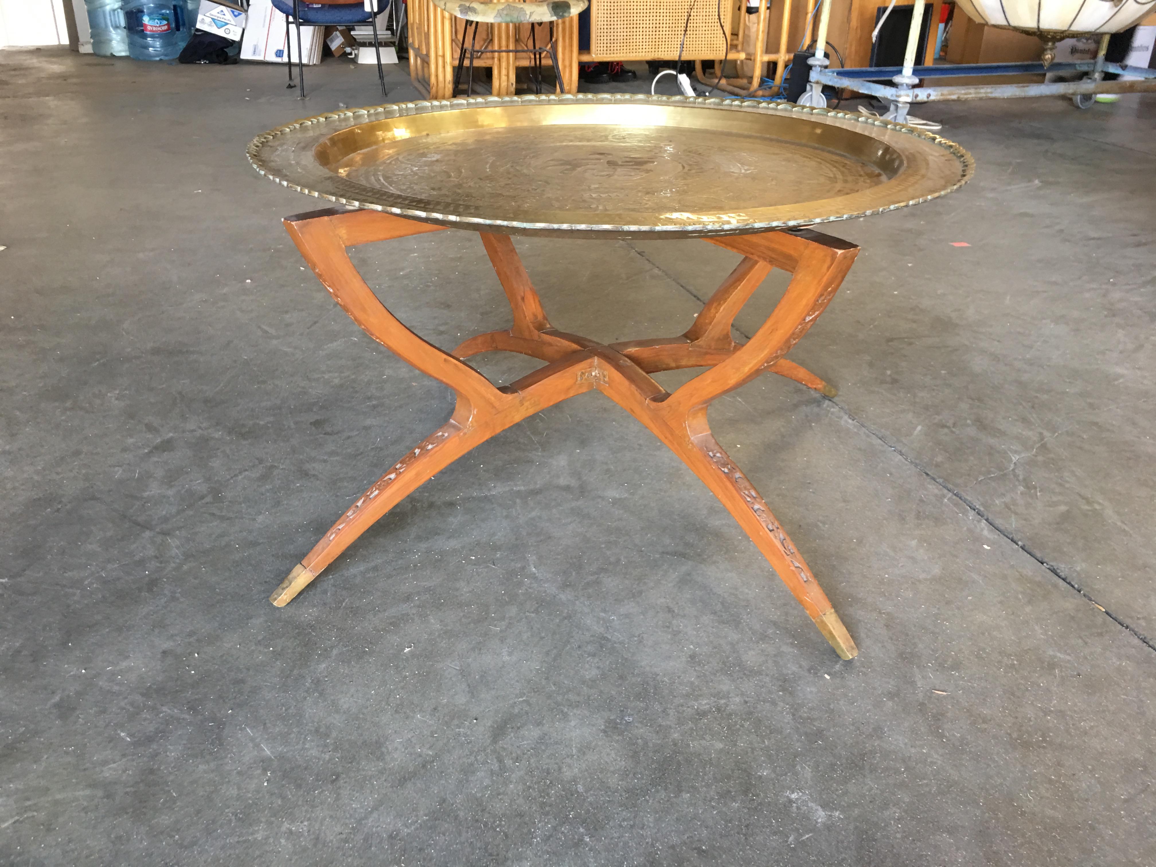 Fabulous folding table with a scalloped brass charger. The brass charger features beautiful etchings inspired by Eastern Asia with a large Chinese character for 