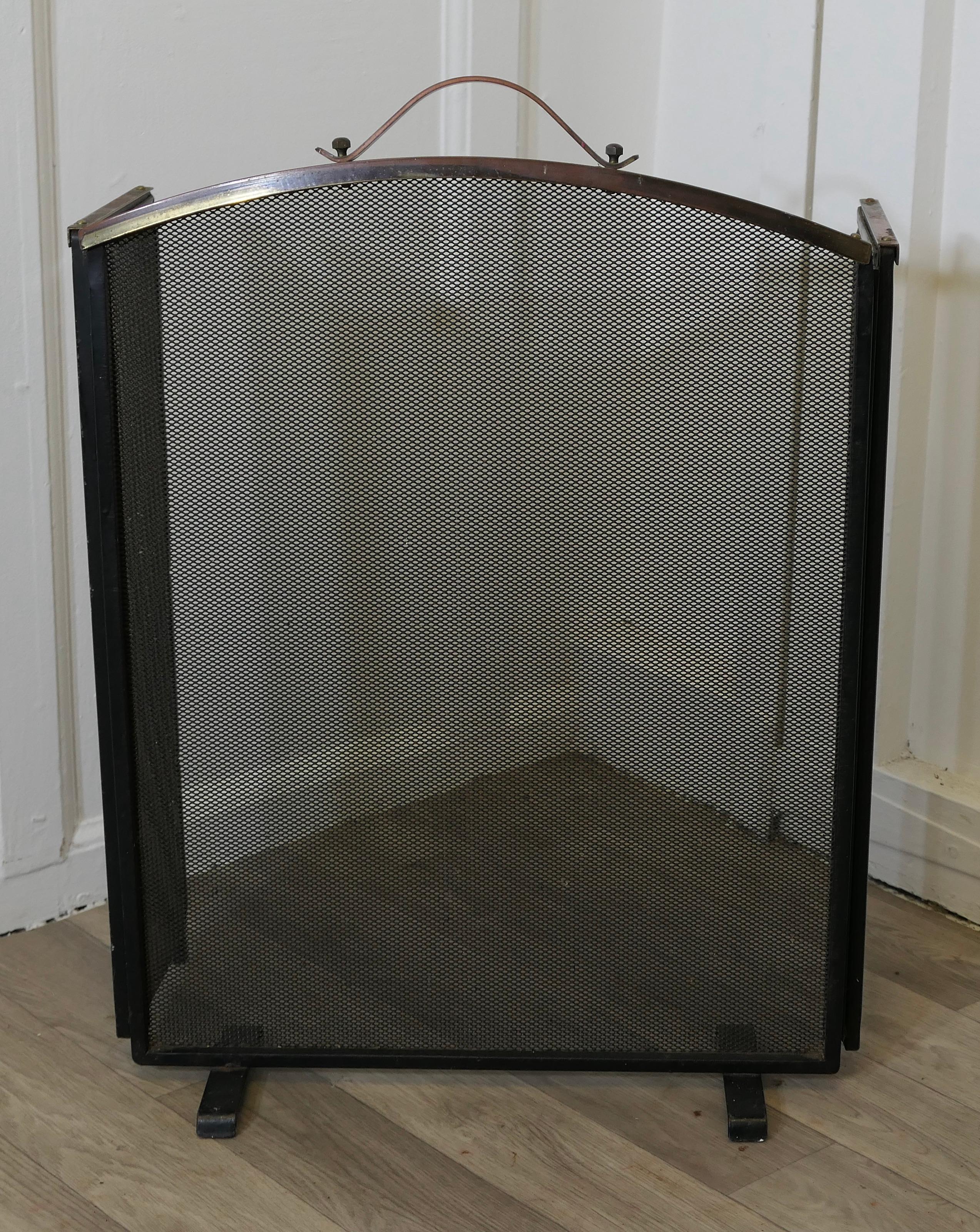 Folding Copper and Fine Mesh Spark Fire Guard 

This very useful spark guard has a copper frame and a fine mesh infill, it has the added advantage that it folds flat for storage, and when opened out it can be shaped to enclose your fire, very useful