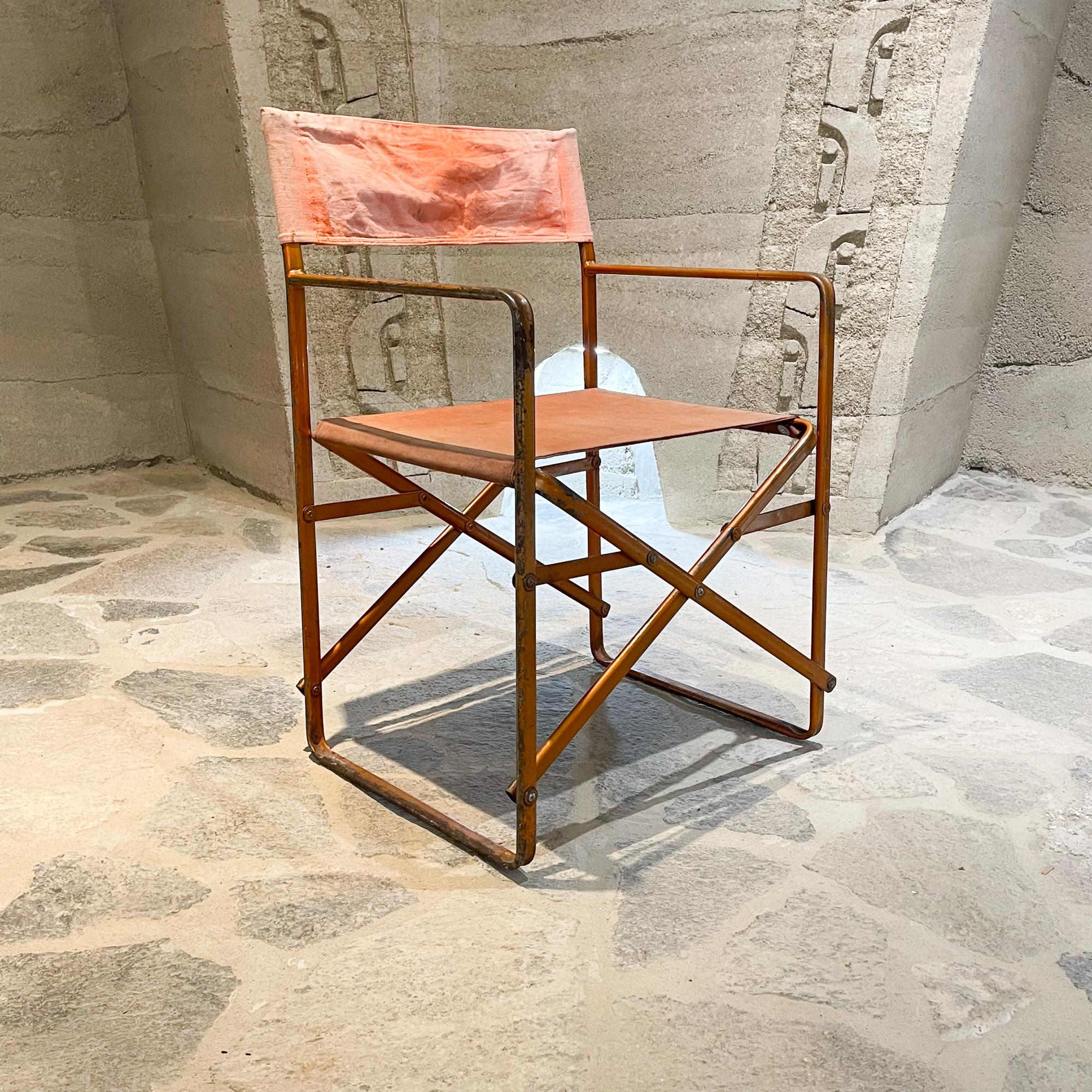 Director's Folding Chair In the style of Gae Aulenti and her folding Zanotta April chair 1964 design, Italy.
Dominant color is orange-rust. Unmarked piece. No maker label present. Made in Metal and Canvas.
Original unrestored fair vintage