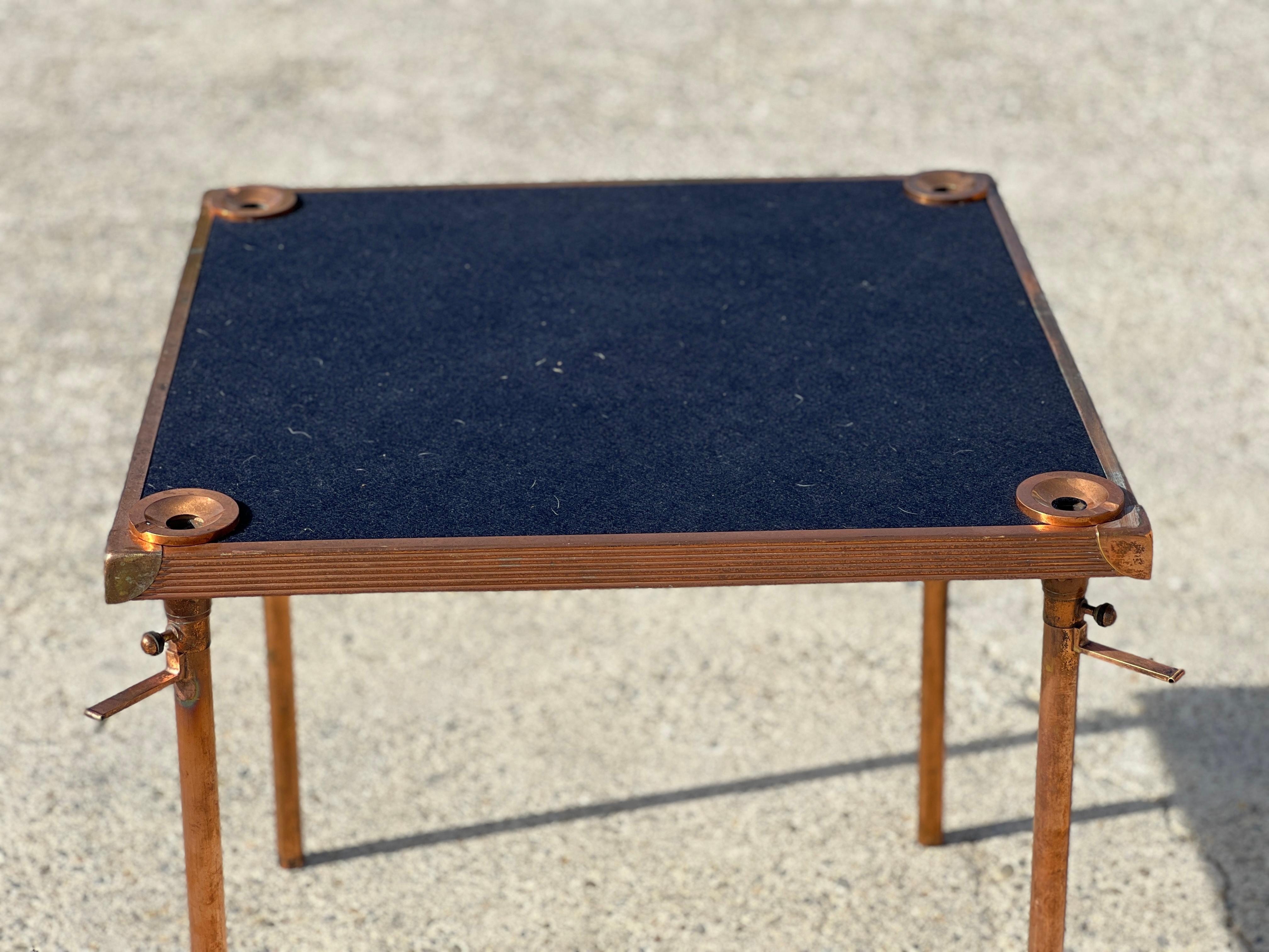 1950 air-tributed game table to Jean Boris-Lacroix in copper metal. Black felt top, four ashtrays on its corners.
Good condition.
   