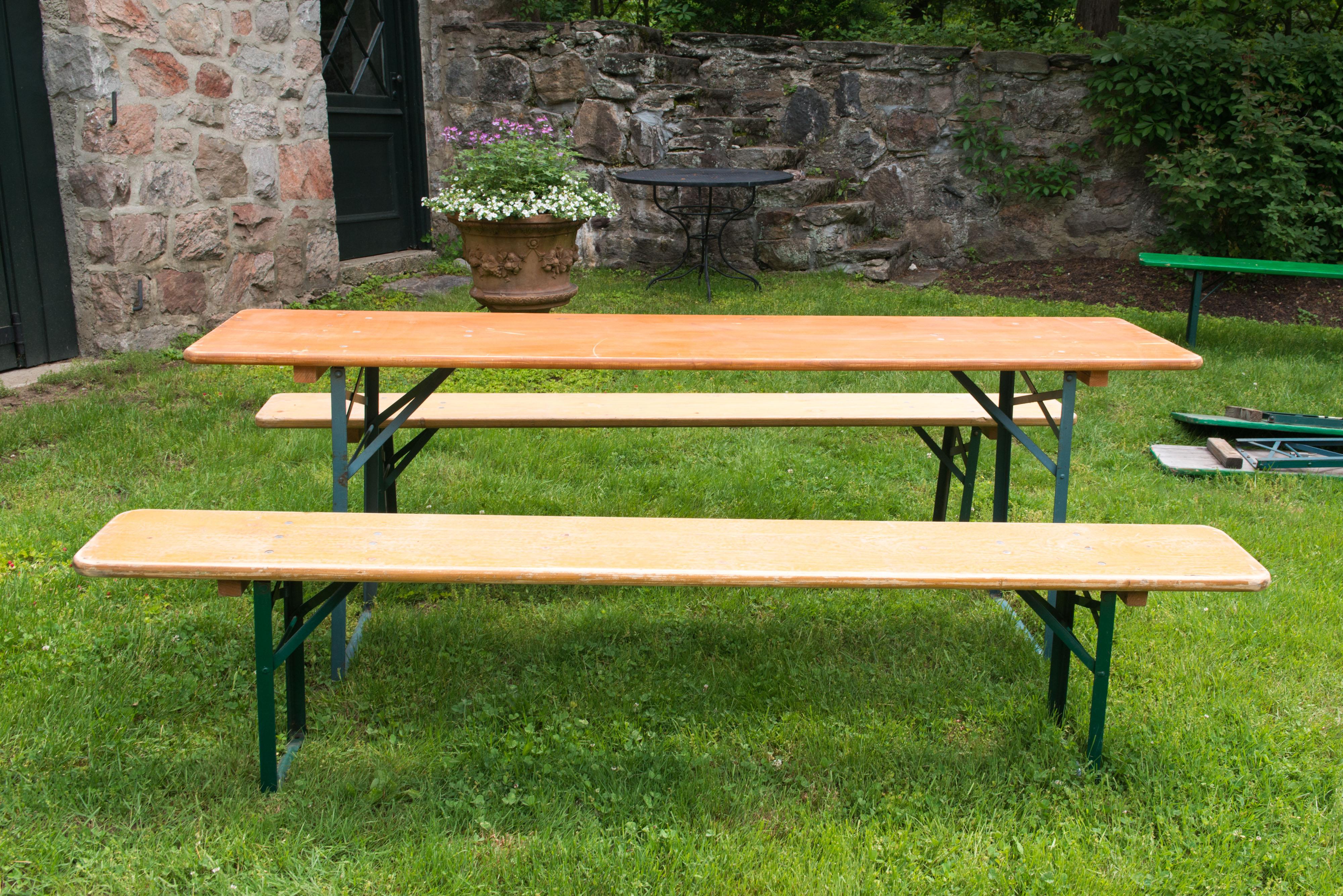 German beer garden wood folding table with two wood folding benches. Sturdy and well made wood surfaces and metal folding legs. Folding mechanism is great German engineering. Benches are 86.5