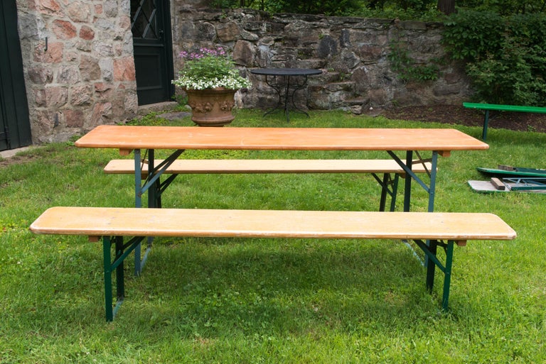 German beer garden wood folding table with two wood folding benches. Sturdy and well made wood surfaces and metal folding legs. Folding mechanism is great German engineering. Benches are 86.5