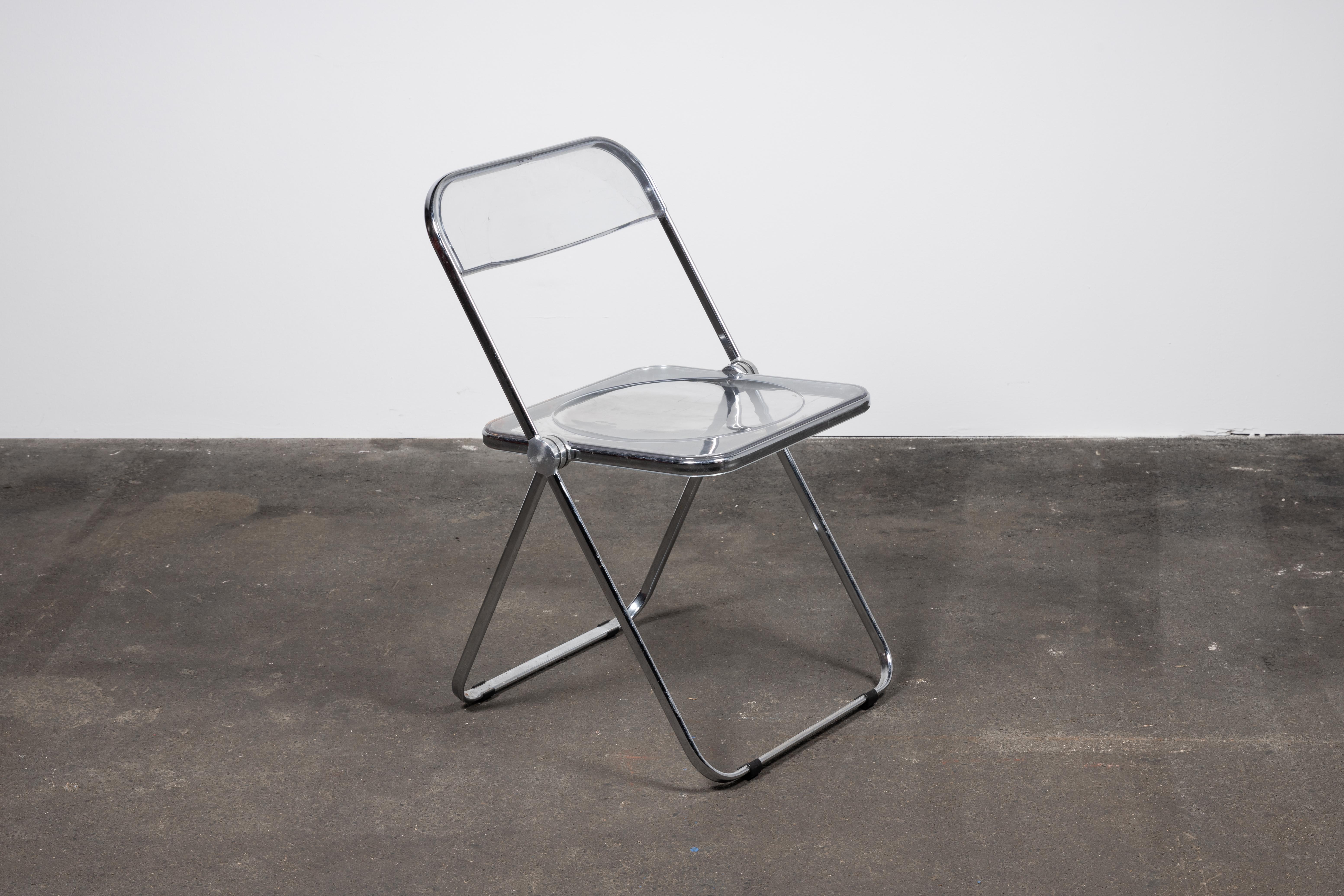 A Space Age chrome and transparent lucite folding chair designed by Giancarlo Piretti for Castelli, Italy. 

With steel frame, seat and back in clear lucite, it represents the realization of “democratic design” and is exhibited at the MoMa museum in