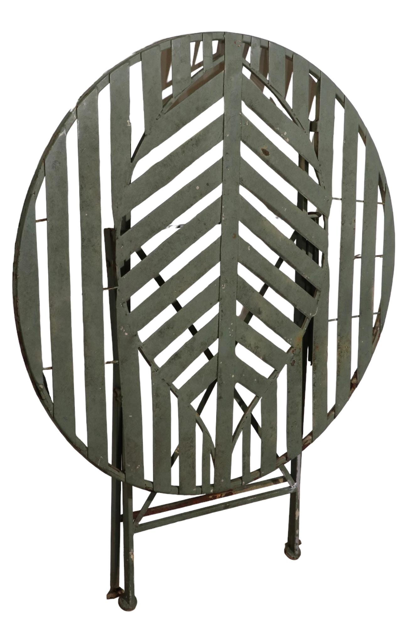 20th Century Folding Metal Garden Patio Poolside Table with Stylized Leaf Motif Top For Sale