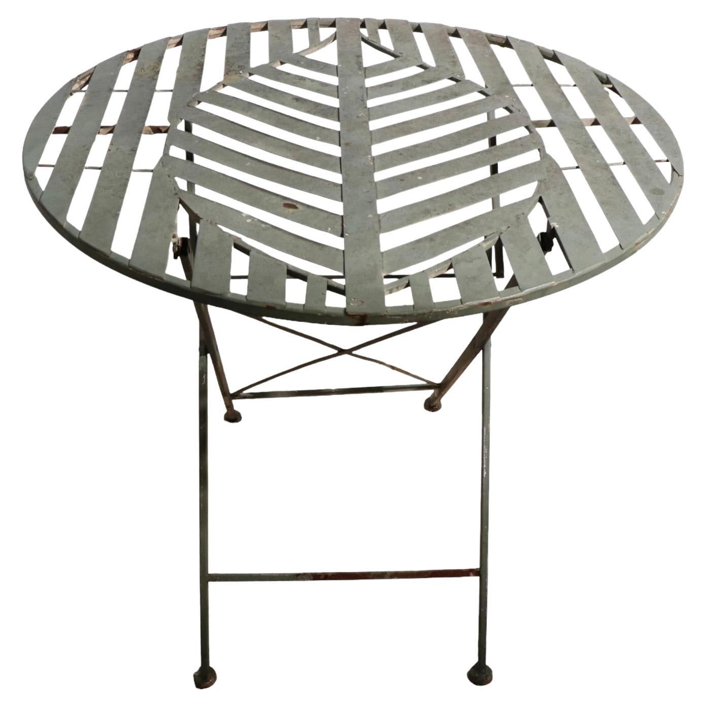 Folding Metal Garden Patio Poolside Table with Stylized Leaf Motif Top For Sale