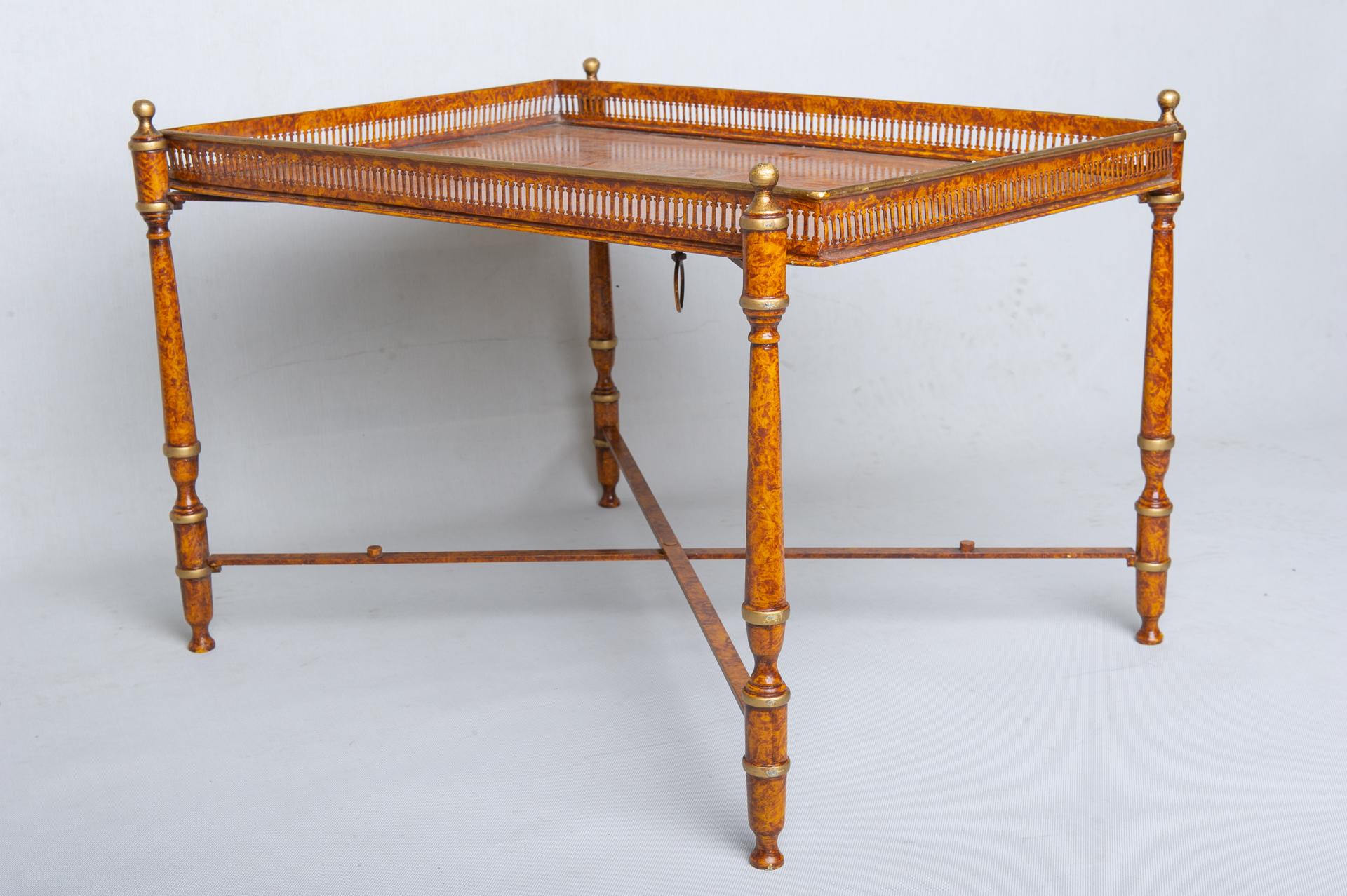 Classical folding metal table with tray: elegant and useful. Faux briar painted, the tray has a small elegant railing that completes it and prevents some saucers from falling. 
The tray is cm. 64,5 x 46 x h.4,5 with lyre drawing; the base is cm.