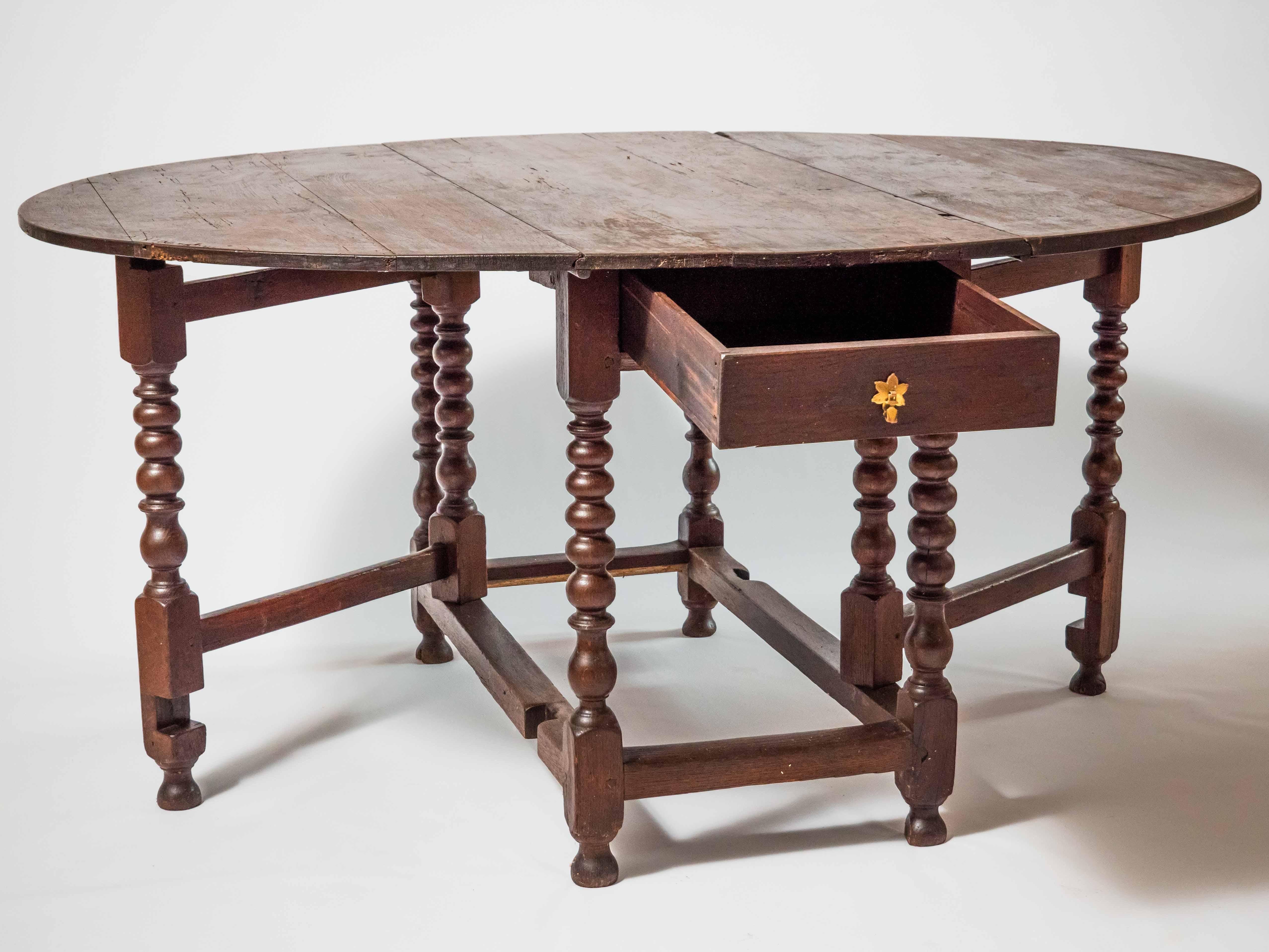 Folding oak Gate Leg Table with drawer

Known as the Gate Leg Table, this wonderful folding oak table is an excellent example of practical and aesthetic furniture. Its design dates back to the 17th century and is still popular today due to its