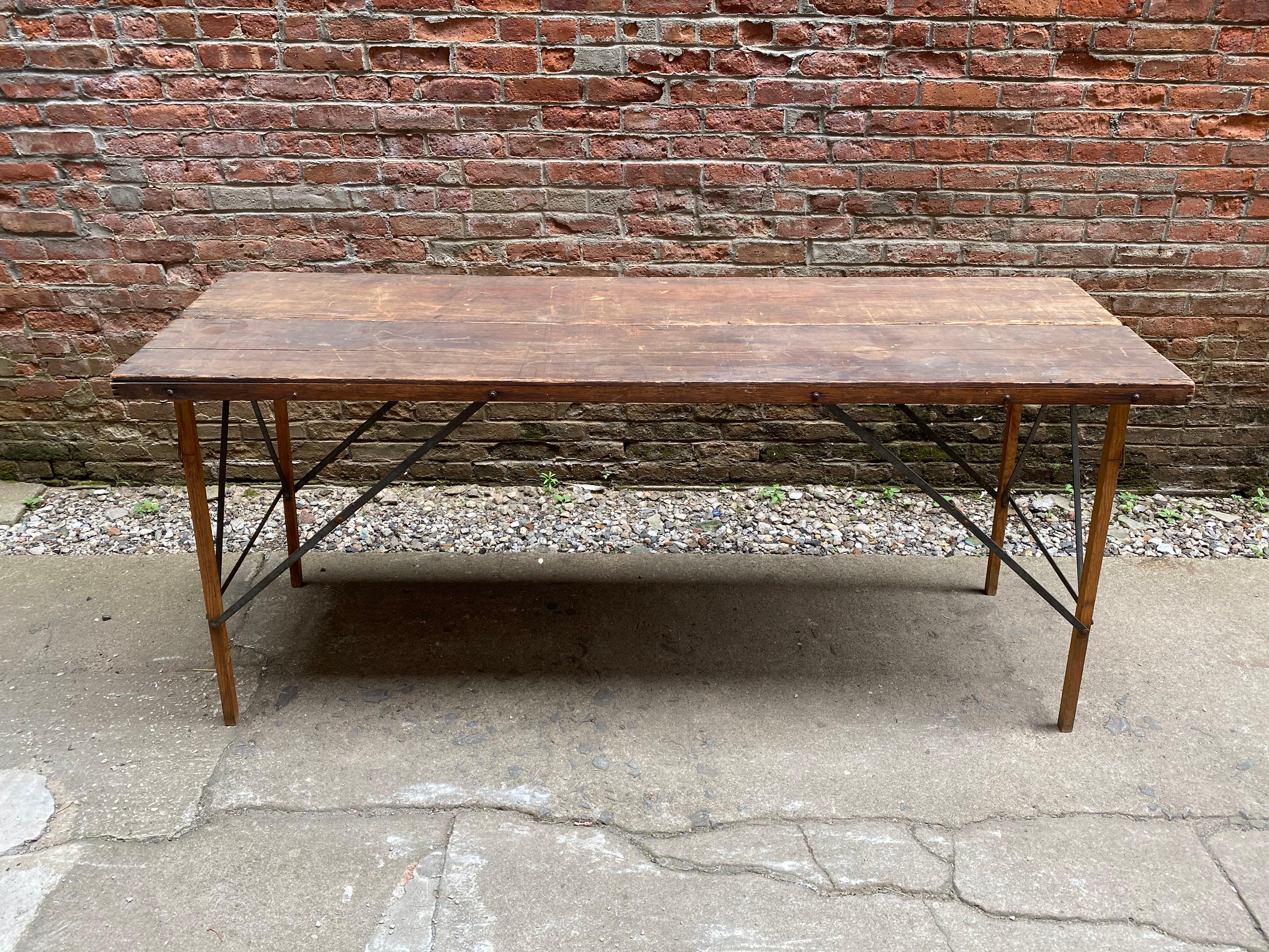 Compact and lightweight vintage wallpaper hanger's table. The legs extend and the top flips open for ultimate flat work space. Great as a console or display. All wood construction, circa 1920-1930. Wear commensurate with age and use. There is a