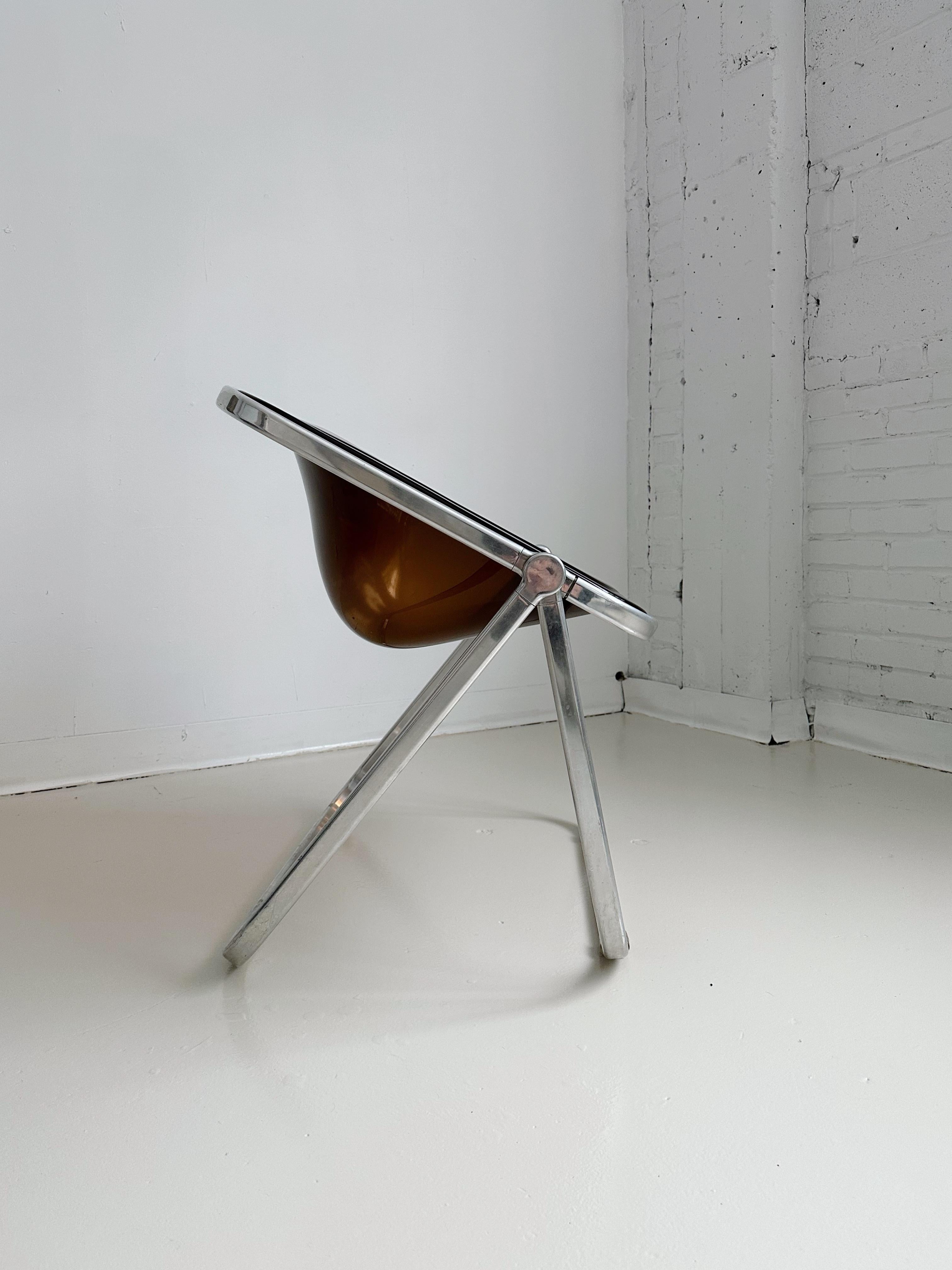 Smoked Acrylic Folding Plona Chair by Giancarlo Piretti for Castelli, 70's
This design is in the permanent collection of the MoMA.

Folded size: 28”W x 10”D x 43”H? 

Very good condition, only a couple of minor scratches on the acrylic seat