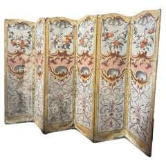 Folding screen on canvas painted with rich floral and leafy decorations, Italy