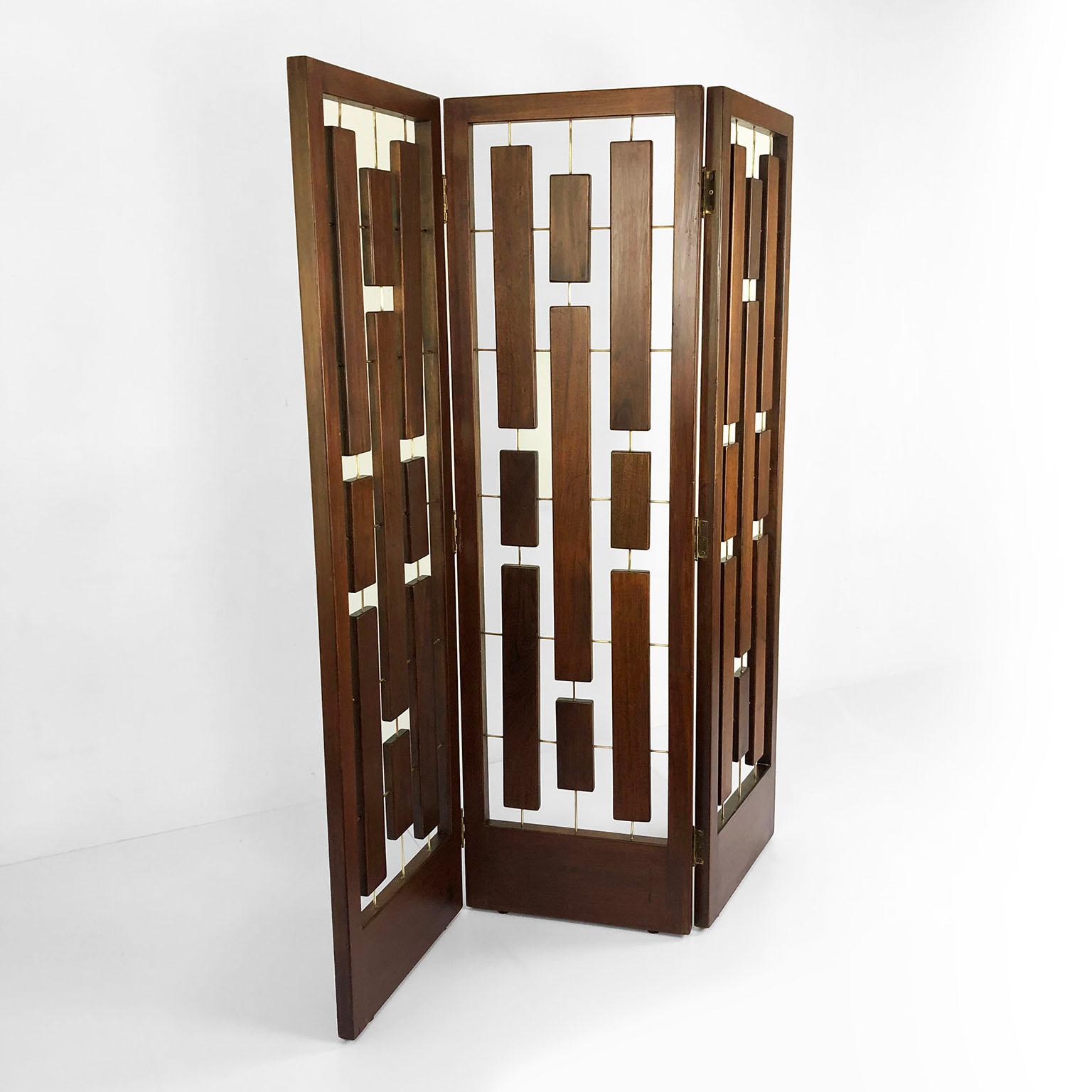 We offer this folding screen made in solid frames of mahogany wood with brass details, circa 1950.