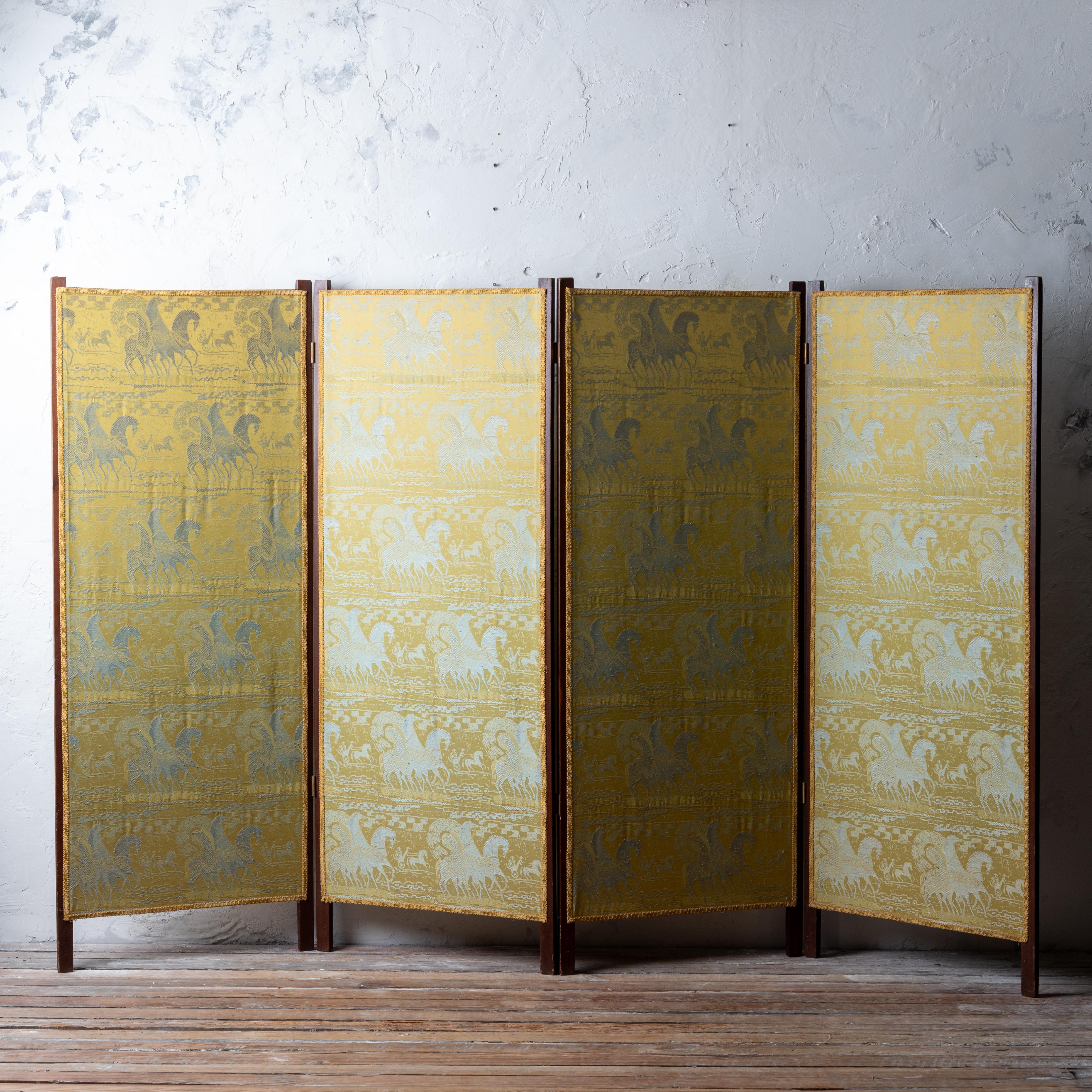 A four panel antique mahogany folding screen with a special Tibor Reich etruscan horse jacquard fabric from the 1960s.  Both front and back are upholstered and pictured.

101 inches fully extended 
66 inches tall
25 ¼ inches wide, each panel



