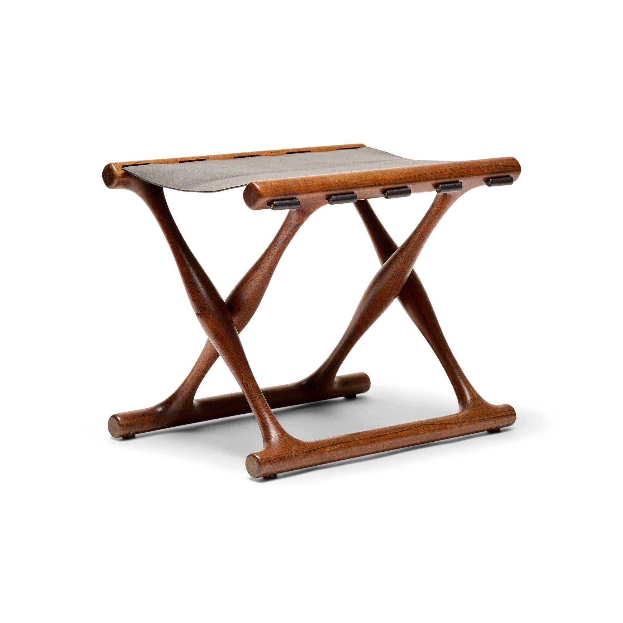 A rare rosewood Vamdrup folding stool with a black leather sling seat.