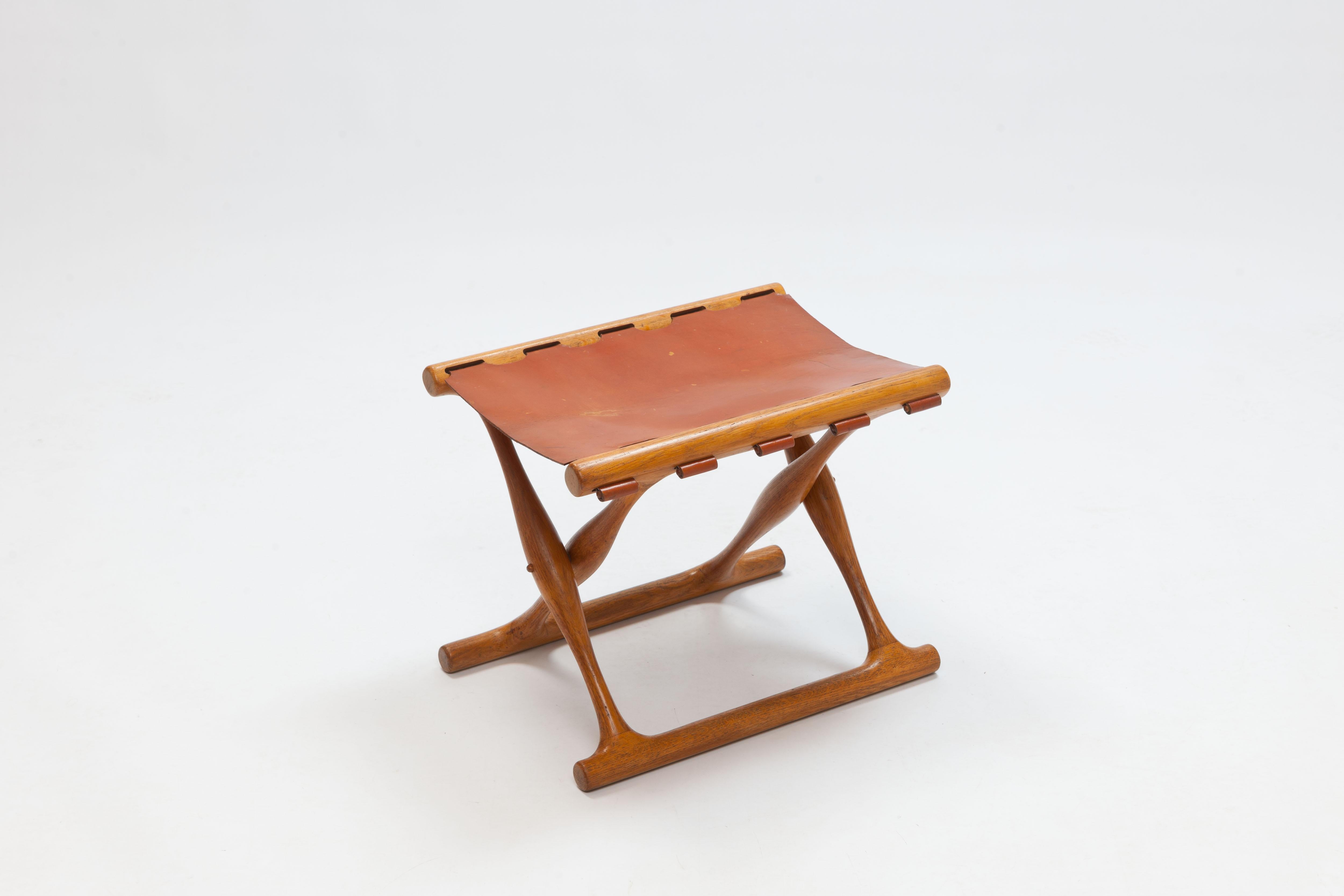 This folding stool, the 'Guldhøj Stole', was designed by Danish designer Poul Hundevad in 1948. Hundevad designed the folding stool after a very special chair; the 'Guldhøj Chair', an archaeological find, a chair, from the Scandinavian Bronze Age