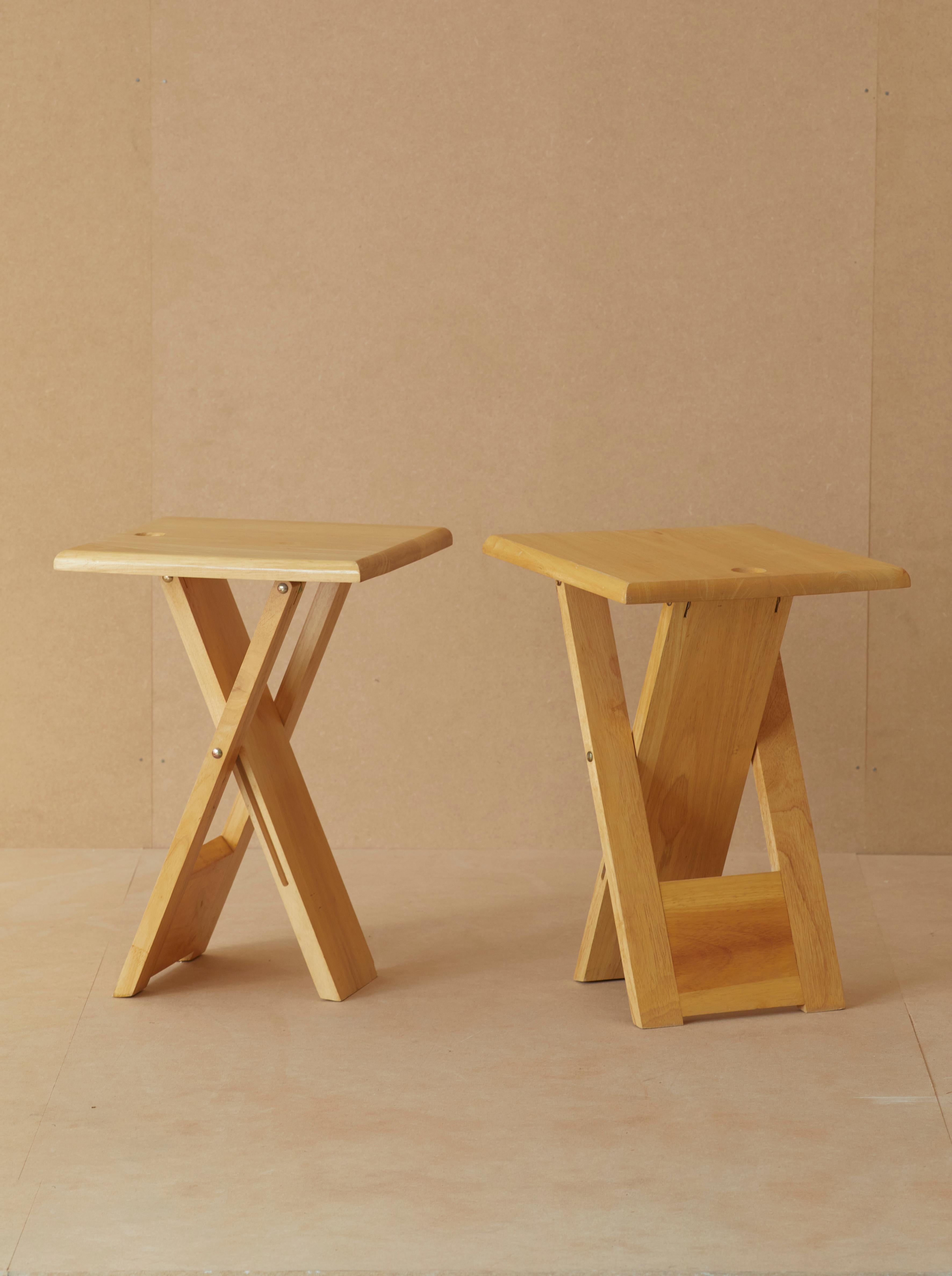 Two folding stools edited by Artefact France (marked) in the 1970s, in the taste of the creations of Adrian Reed and Roger Tallon.

A smart and practical design in solid beech wood that can be folded and hung.  

A rare set in this squared version.