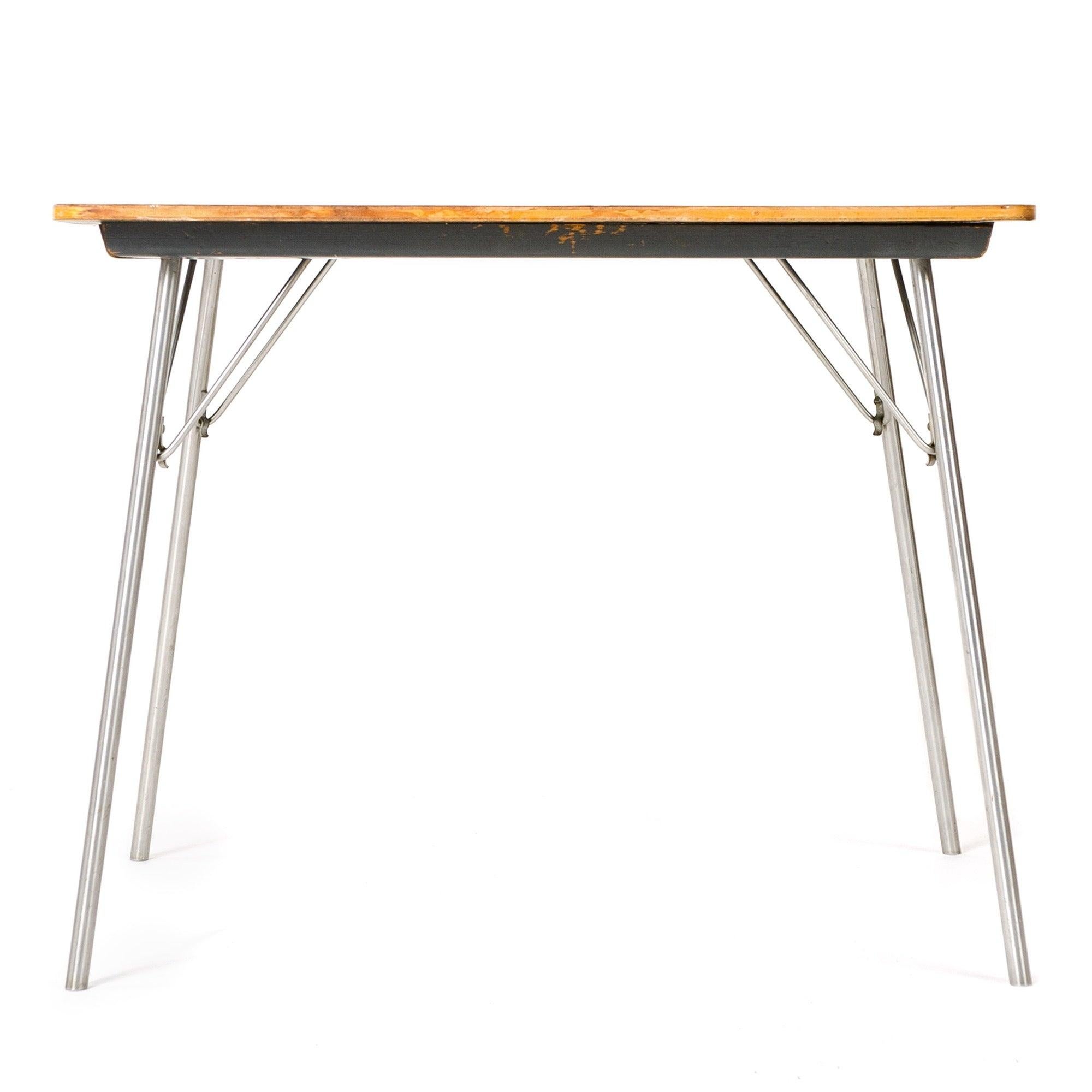 Eames for Herman Miller IT occasional table with chrome plated steel, lockable, folding legs suitable for uses such as light dining, card table, computer, or other ancillary use in a residential or commercial setting. Manufactured by Herman Miller