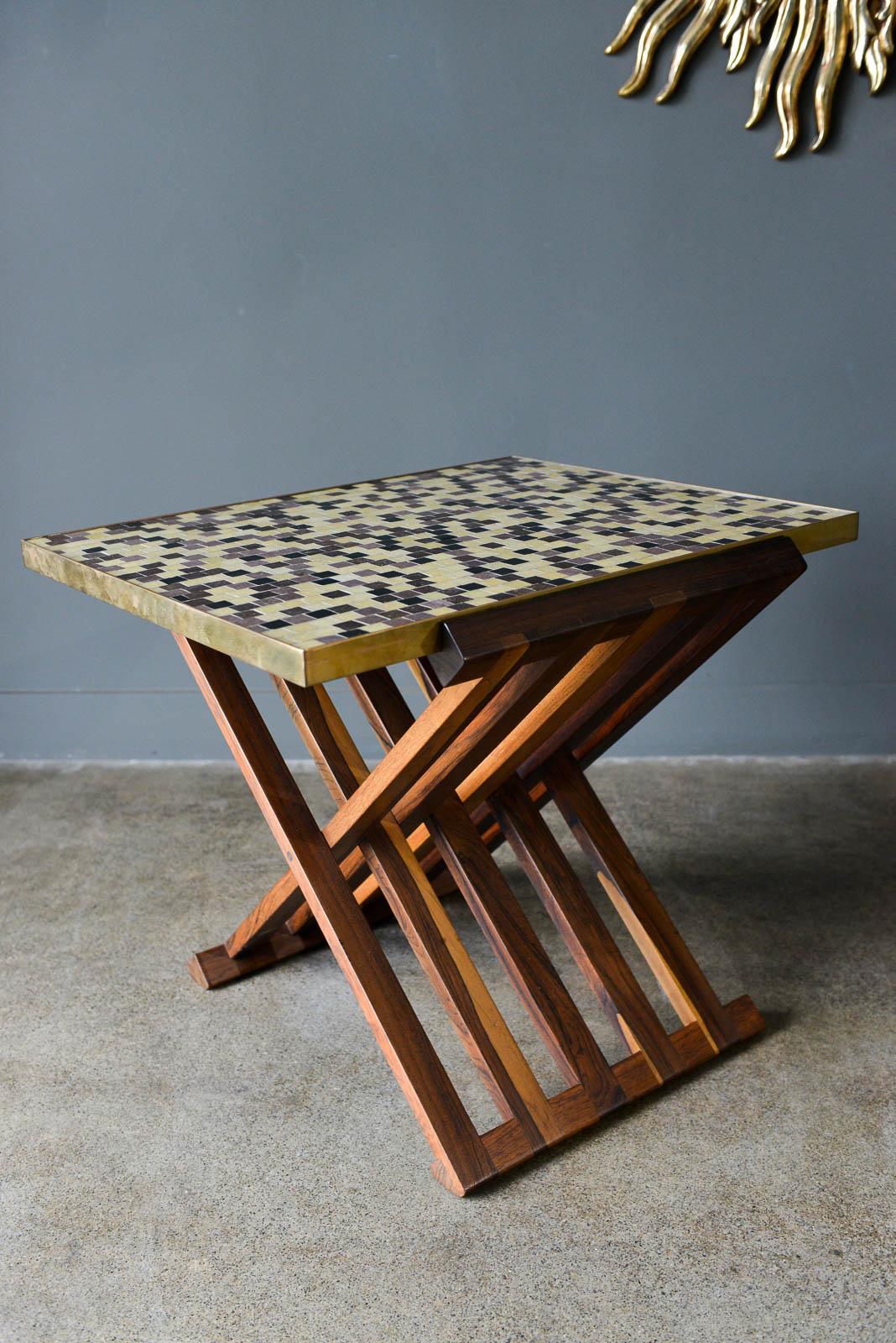Folding tile top table by Edward Wormley for Dunbar, circa 1960. Table includes two authentic removable trays, one tile top with authentic Murano tiles and the other with an original white leather top. Solid rosewood folding base with brass accents.