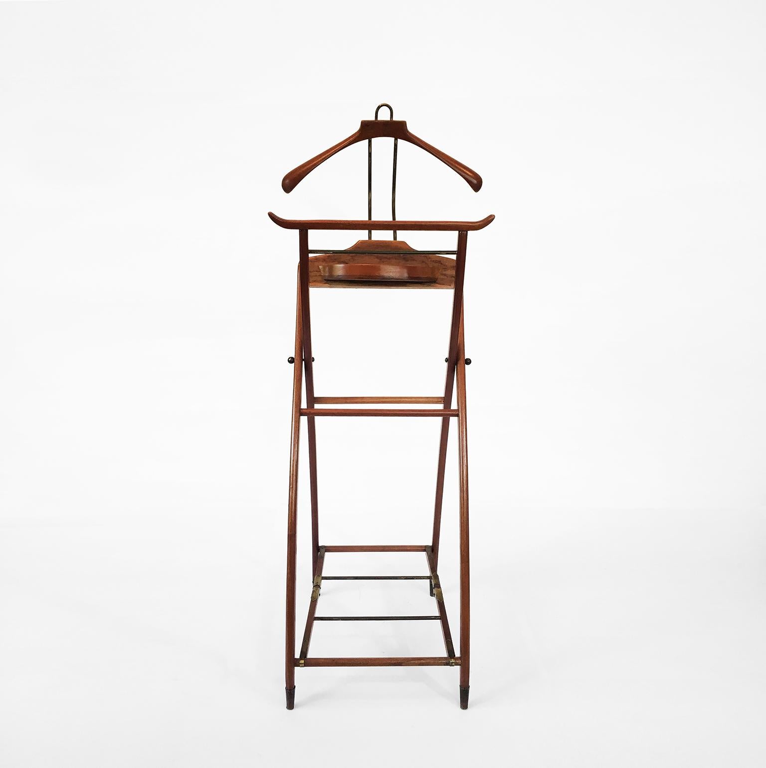 Mexican valet stand, circa 1950, made of mahogany and brass accents.