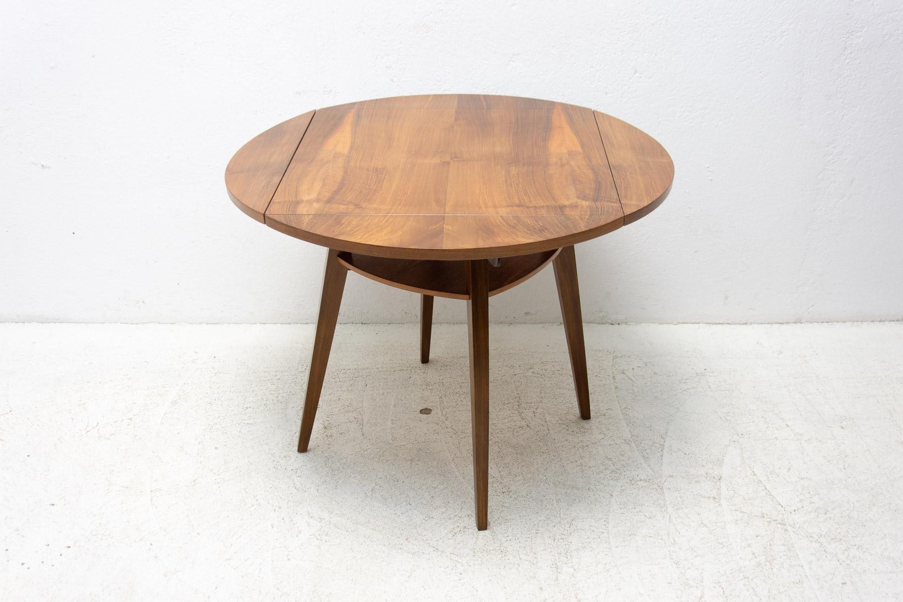 This table was made in the former Czechoslovakia in the 1950s. It is made of walnut wood and has an unusual and interesting design, which is designed so that the table can be folded and unfolded as needed.

It´s in excelent condition, fully